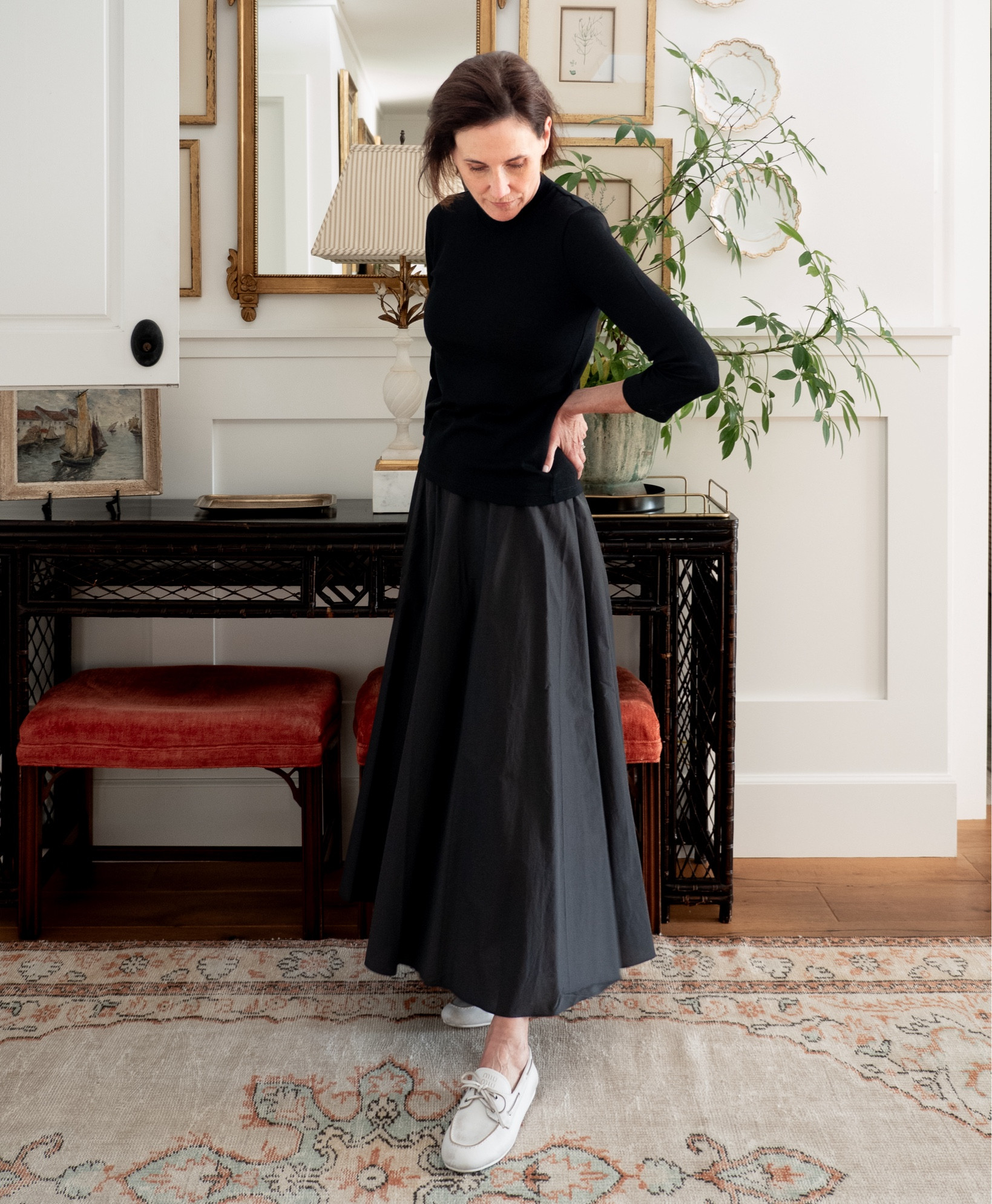 For most of September and October in California, the best way for me to feel like I’m dressing for the season is to wear a dark palette in lightweight fabrics. I'll reach for cottons, silk voile, and semi-sheer wools to pull together looks that create a fall vibe. ⁠
⁠
One silhouette I love to work in is an elbow length sleeve top. The one I'm wearing is new from Vince. The fit and weight are perfection. I'll probably get a backup since I'll wear it so much. I also bought it in brown which looks very berry like on the website but is more rust brown in person. ⁠
⁠
The Theory black cotton skirt is a summer purchase and still available. It's very lightweight and perfect for warm autumn days.⁠
⁠
I like all black with a contrasting shoe color. Here with one of my favorite shoe purchases from spring/summer - the Miu Miu boat shoe in weathered white. Splurgy for a boat shoe but to me special enough and crazy comfortable. No regrets.⁠
⁠


#LTKStyleTip #LTKSeasonal #LTKFallSale