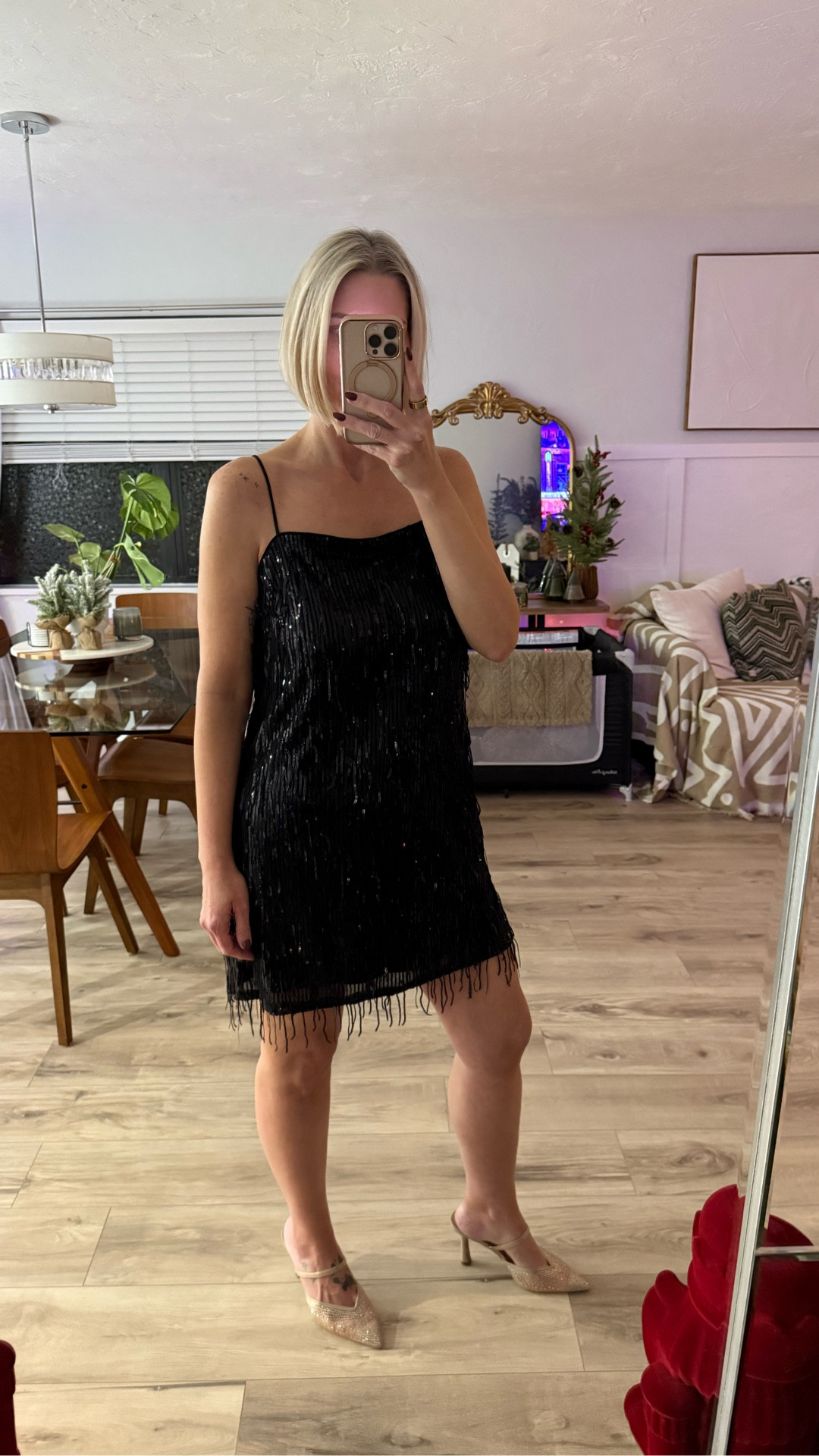 This little black dress is absolute perfection! The sequin fringe adds such a fun touch! It runs slightly on the larger side, I’m wearing a small. 

My heels are stunning with the nude/gold tones with the rhinestones. Perfect for the holiday season. I’m wearing a 7.5 and they run tts. 

#LTKHoliday #LTKSaleAlert #LTKFindsUnder50