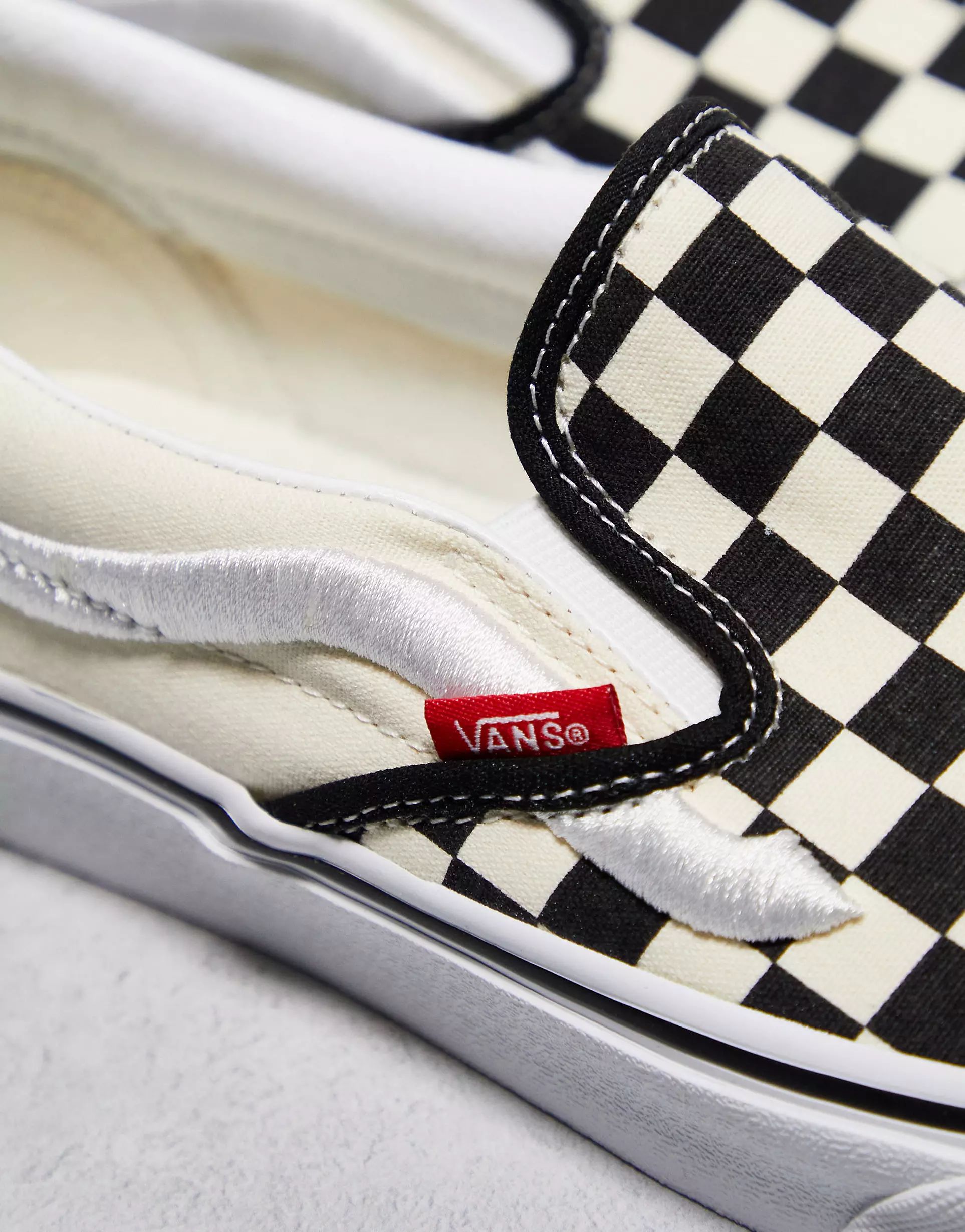 Vans Classic slip on in checkerboard print in white and black with white stripe | ASOS (Global)