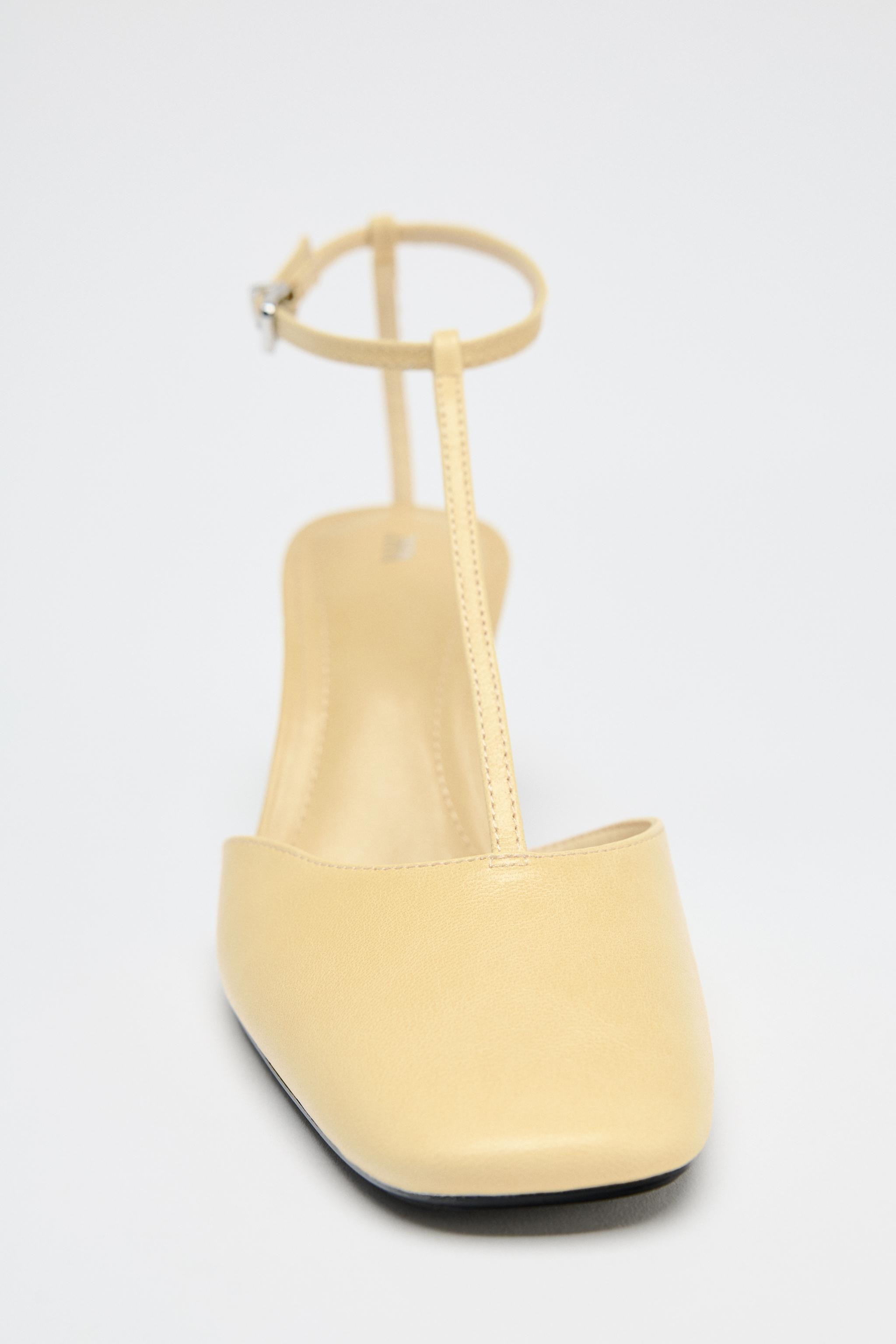 Leather slingback heels. Strap detail at the front. Thin mid-height heel. Ankle strap with buckle... | Zara US