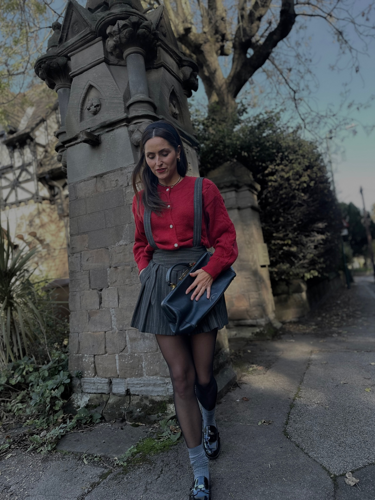 Discount code for this cardigan is ‘Zielin20’. 

Cherry red cardigan. Cherry red sweater. Cherry red trend. Grey pleated skirt. Pinstripe skirt. Preppy outfit. Autumn outfit. Winter outfit. Black loafers. Grey socks. Pleated mini skirt. Mini skirt
The Cambridge Satchel bag. Handbag. 

#LTKshoecrush #LTKeurope #LTKitbag