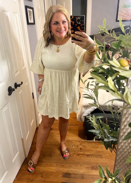 Free People has me in a chokehold this spring!
This tiered babydoll dress is everything. The material is lightweight and gauzy.  Long sleeves that are slouchy make this the perfect transition piece. It comes in 8 different colors. Paired here with Birkenstocks, Madrid.
Dress has an oversized fit, that typical Free People fit 💛
Easter dress, Easter outfit, spring outfit, spring dress, sandals, casual dresss

#LTKfindsunder100 #LTKFestival #LTKstyletip