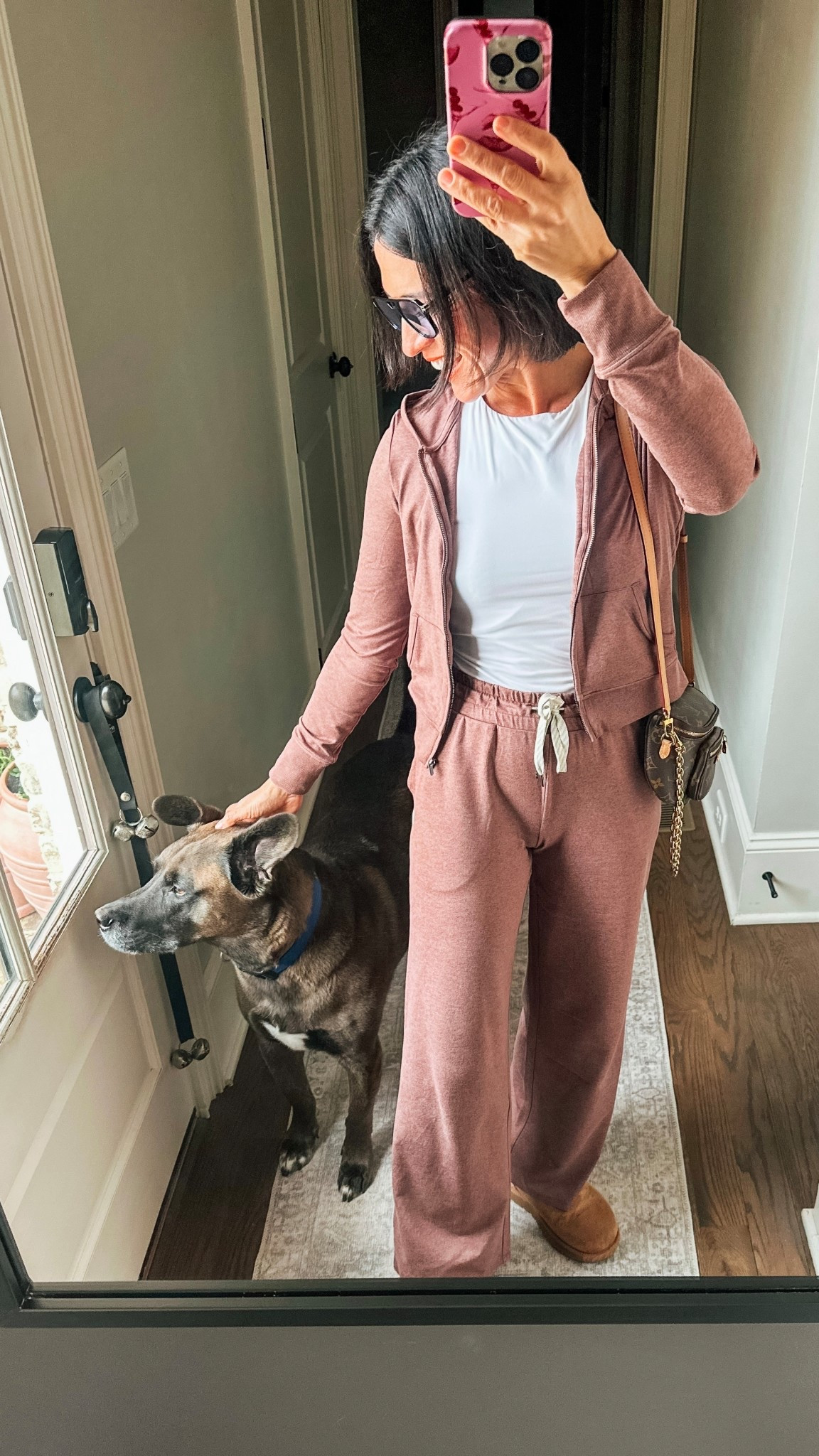 When your OOTD turns into a dog mom moment 🐾🤎
But honestly… not mad about it because this @Vuori US  matching set is everything.
The wide-leg pants + cropped zip-up hoodie combo is the definition of effortless elevated.
This brown heather color? Obsessed.
And the fabric is beyond soft , like “live in it, run errands, lounge, repeat” soft.

Matching sets, but make them chic ✨
Linked for you here

#LTKootd #LTKdayinmylife #LTKmomlife
