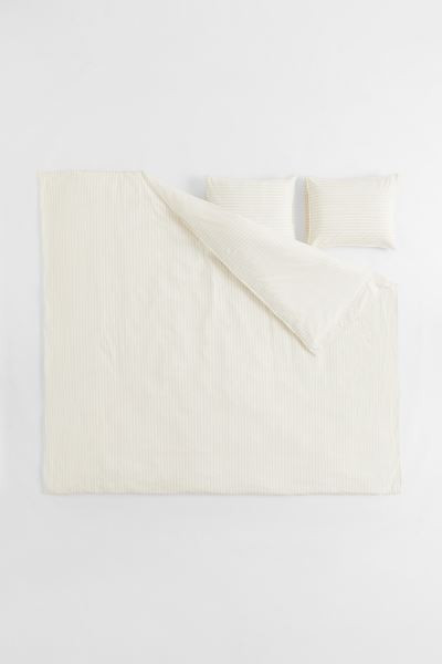 King/queen duvet cover set in woven organic cotton fabric with stripes. Duvet cover fastens at fo... | H&M (US + CA)