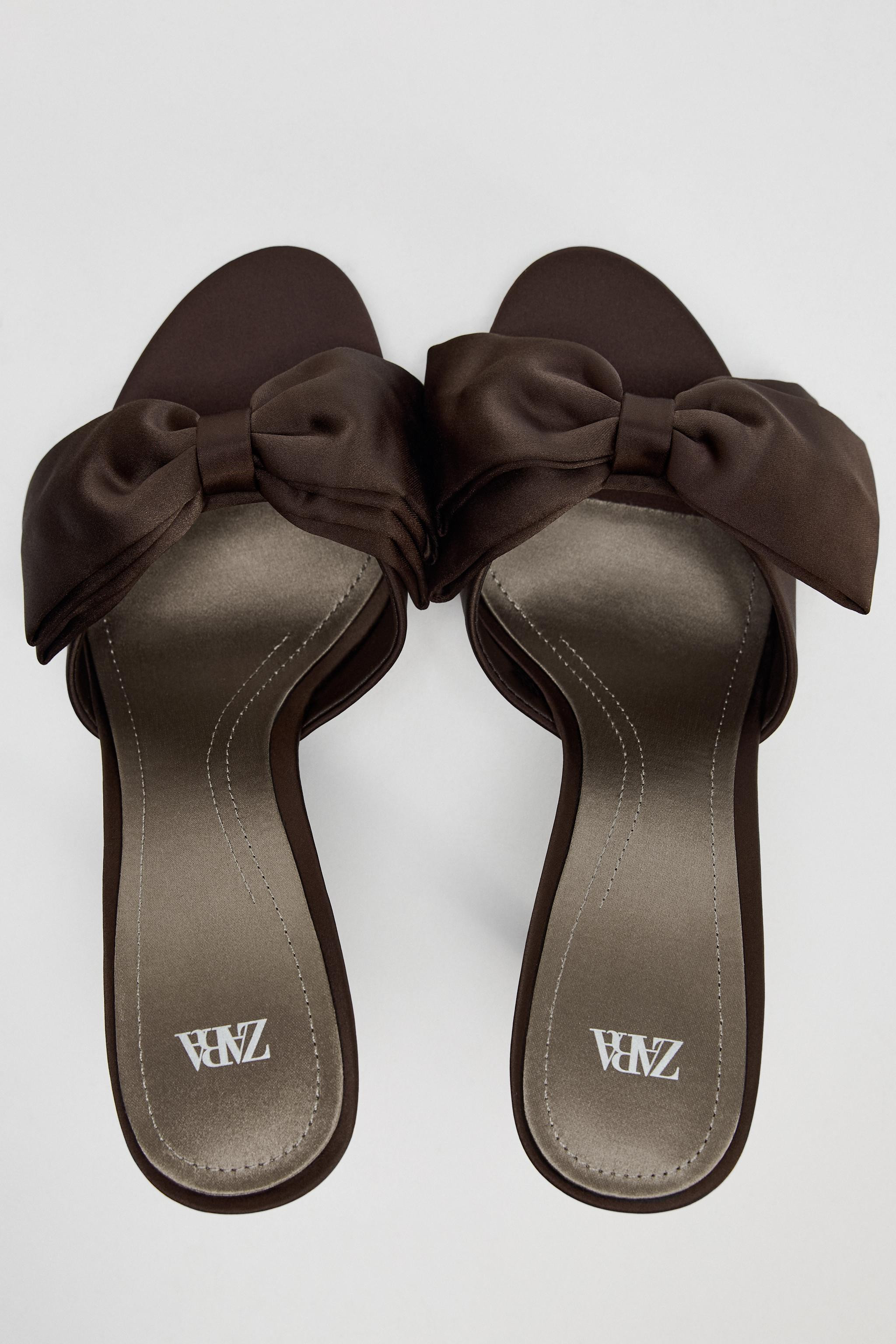 Satin finish mule sandals. Maxi bow detail at the front. High stiletto heel. Pointed toe. Heel he... | Zara US