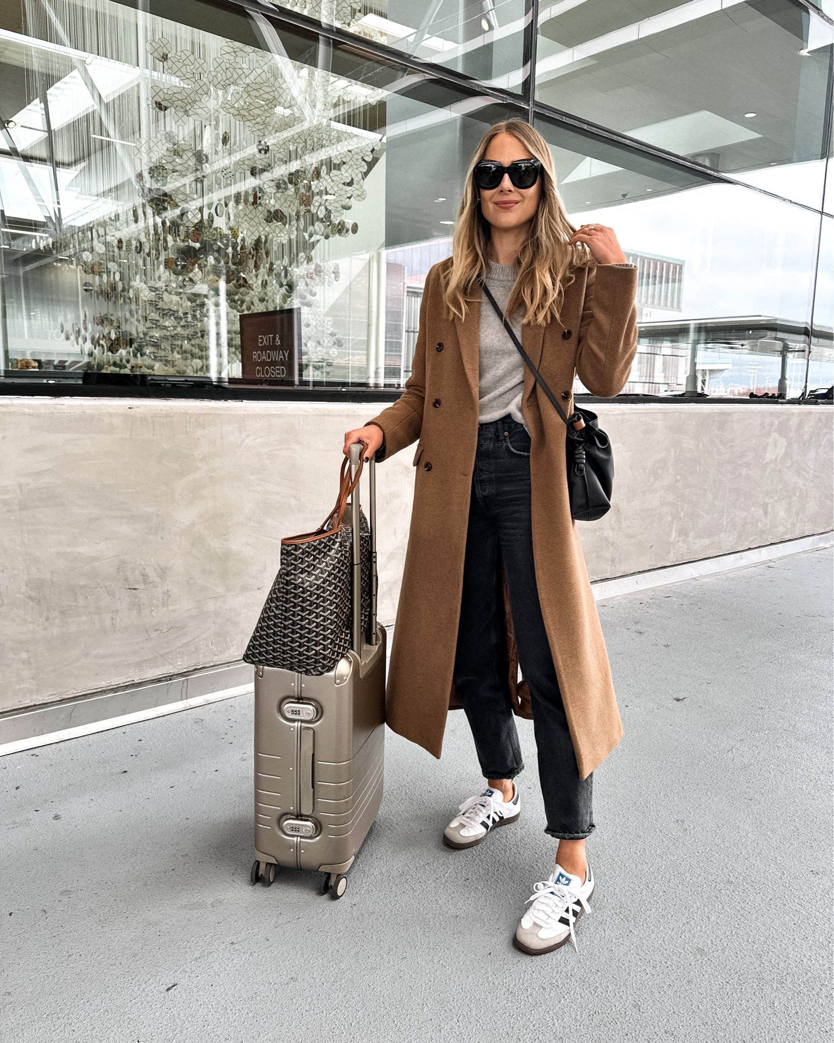 Fashion Jackson wearing camel coat (small) grey sweater (JACKSON15 discount code) AGOLDE jeans, samba sneakers, travel outfit, Goyard bag #fashionjackson #travel #sneakers 

#LTKunder100 #LTKstyletip #LTKtravel