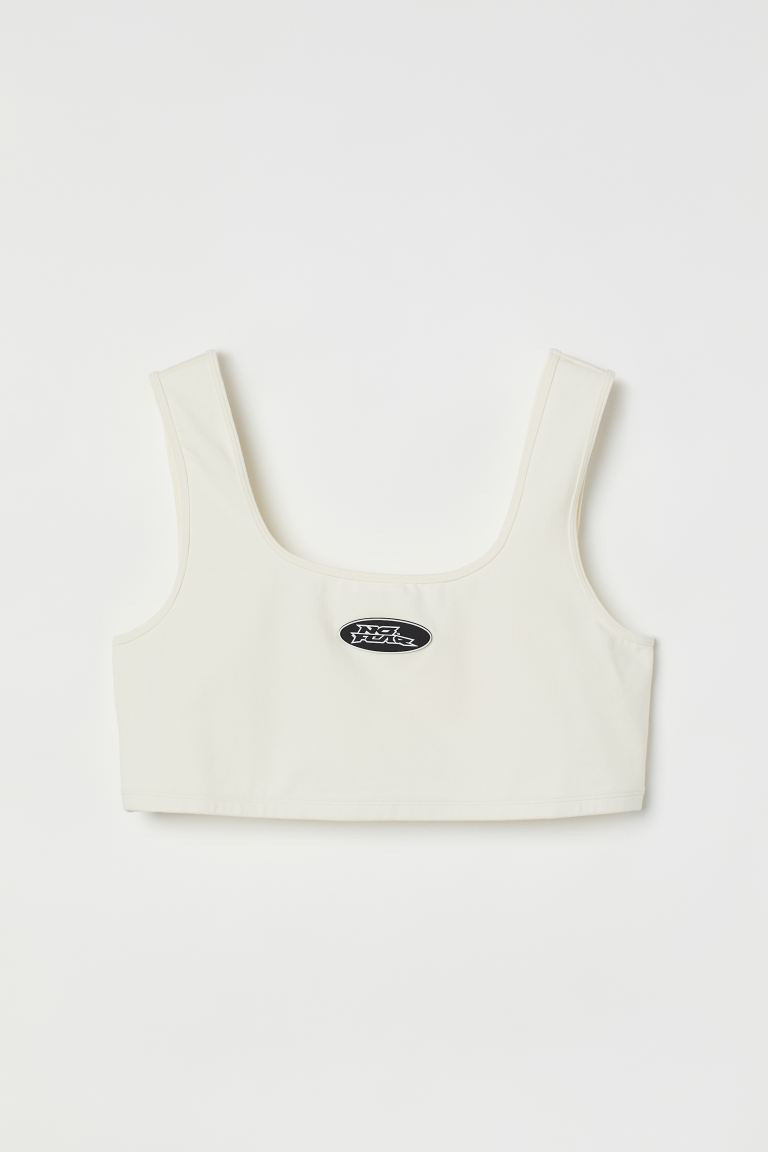 H&M+ Jersey crop top - Deep neckline - Sleeveless - White/No Fear - Ladies | H&M GB | H&M (UK, MY, IN, SG, PH, TW, HK)