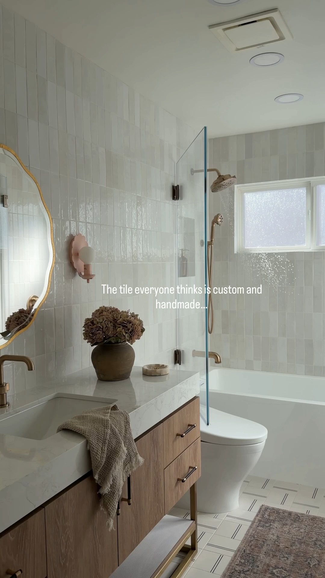 This bathroom was designed with so much thought and making it look high end on a budget. The handmade looking tile is a great price point and looks so much more expensive than it really is. This vanity looks so custom and saved our clients so much $$$$. Anytime you can buy a vanity with a countertop you’ll save thousands since you don’t have to buy a countertop plus pay for fabrication. Wayfair is always my go to for custom looking vanities and anything home decor related. Be sure to check it out! 

#ad #wayfair @wayfair #wayfairpartner

 Wood vanity oval capsule, mirror, rectangle, mirror, medicine cabinet, brass faucets, brass hardware, shower system, white soaking tub bra, sconces, bubble chandelier, bathroom, accessories, white tile, gray tile marble tile sink rug runner

#LTKHome