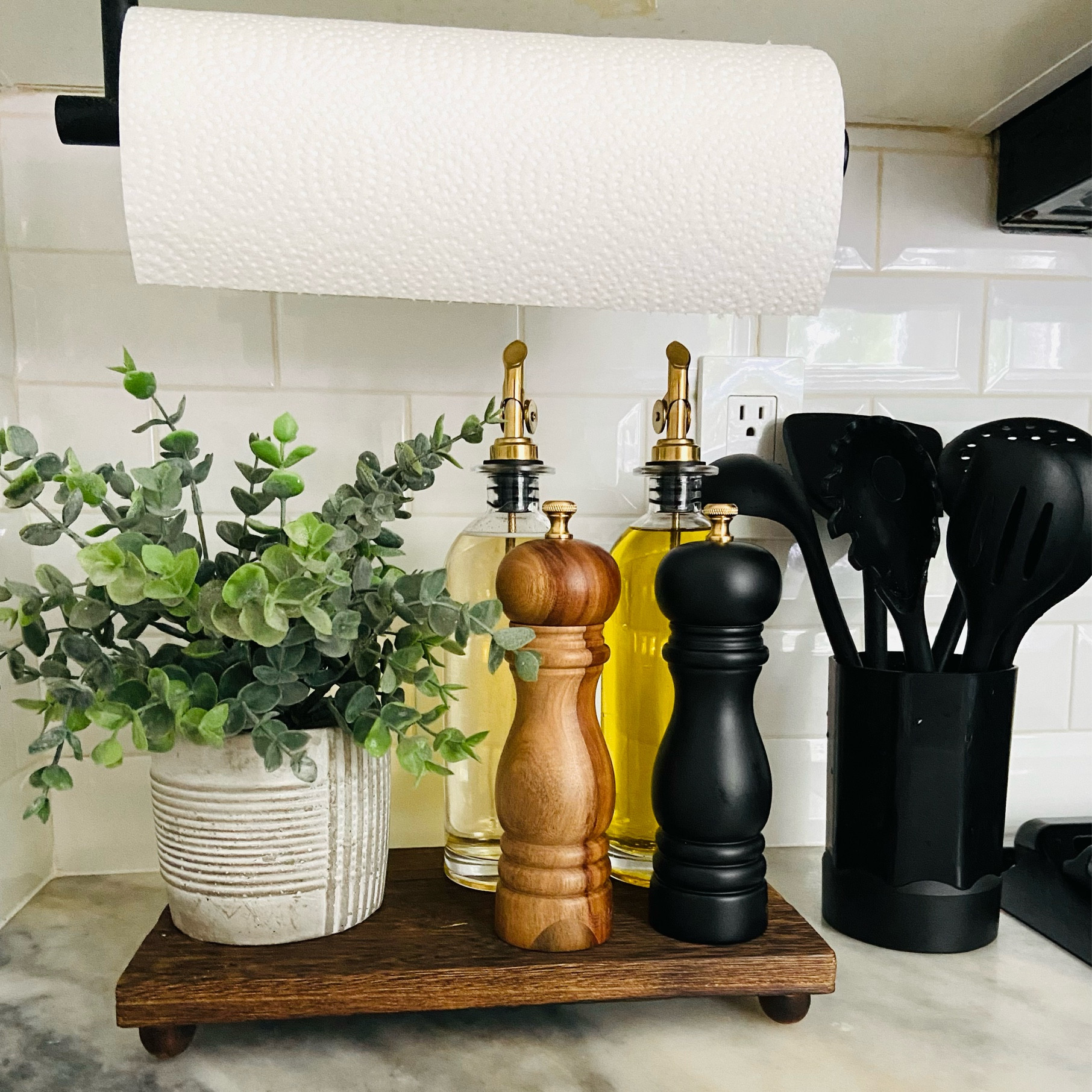 Kitchen countertop finds.
I love mixing classic wooden finds with modern finds. 
These wooden salt and pepper grinders not only work great, but look great. 
The glass oil dispensers come in large and smaller sizes to fit your needs; and have the beautiful gold dispenser touch. 
This wooden pedestal comes in two shades and gives the perfect bump of height. 
These silicone utensils are heat resistant and dishwasher safe. I love using these with my Caraway cooking set. 

#LTKhome