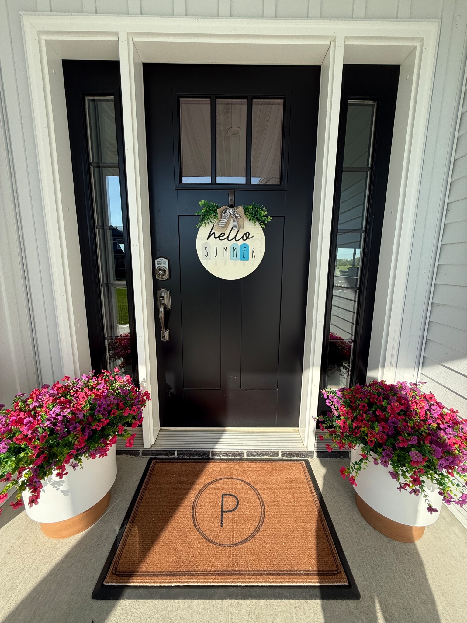 Still summer for another month!  

I saw these planters on my morning walk and paired them with these faux flowers for a pop of color on the porch.  I used two bunches of flowers in each pot.  It’s an investment but so are real flowers and I’ll get multiple seasons out of these.  

Sitting with our washable monogrammed doormat.

We’re keeping things low maintenance around here…no more dying flowers with our busy schedules!  

#LTKSeasonal #LTKHome