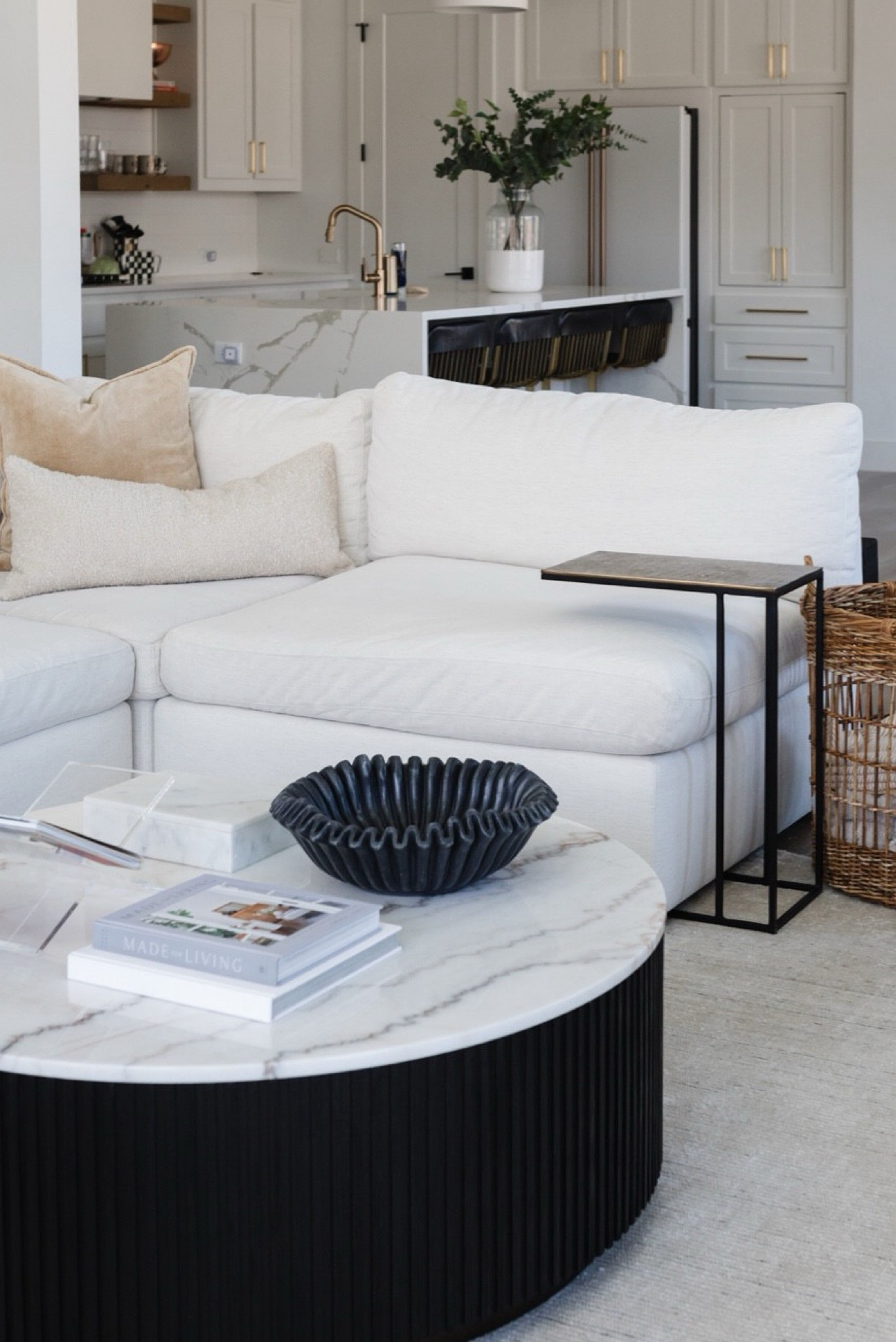Living room decor with white sectional, marble coffee table, large basket, martini table, and our favorite ruffle bowl. We love our bowl because it’s black marble, large enough to store stuff and looks very sleek  

#LTKStyleTip #LTKHome