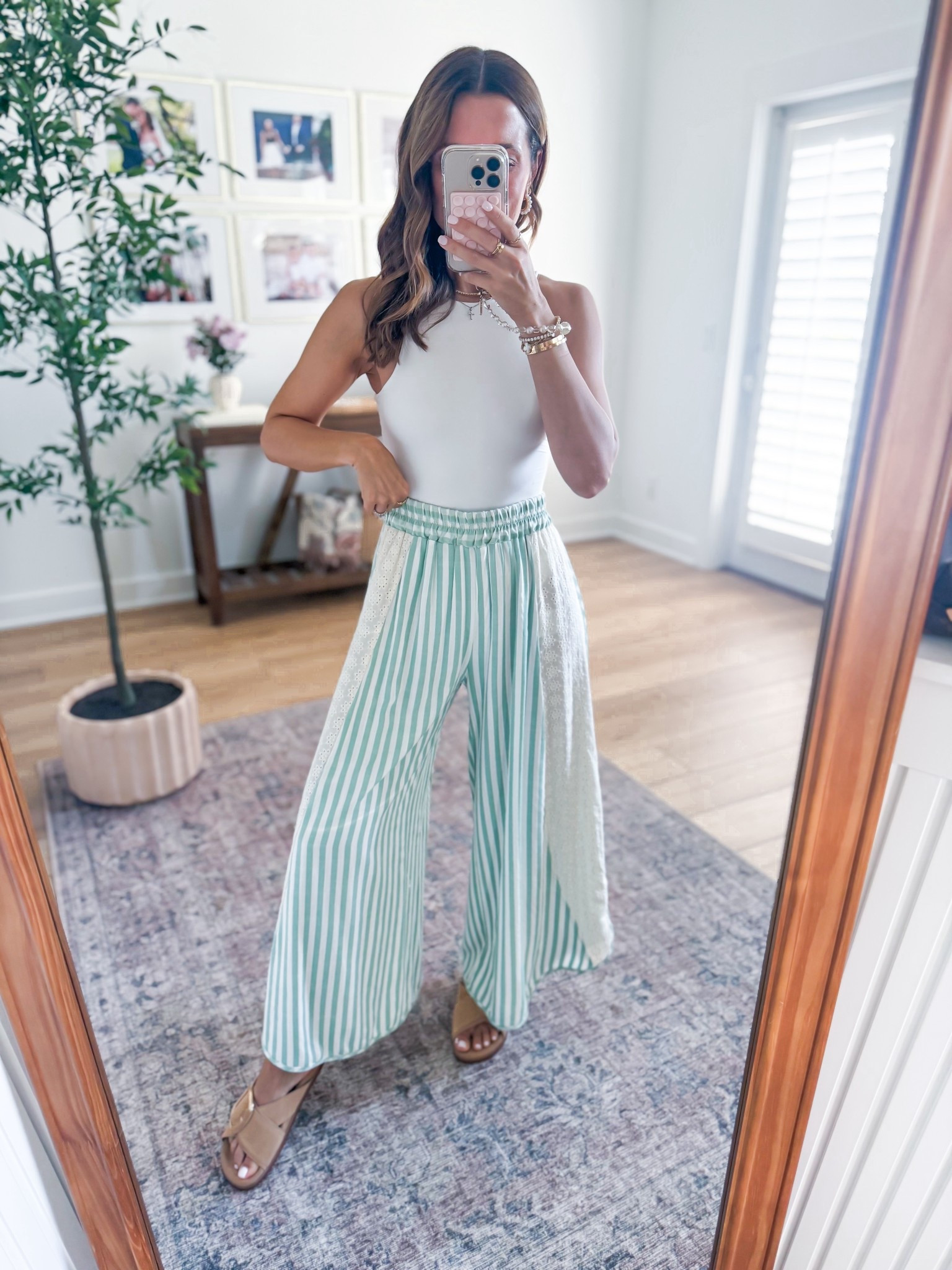 My spring outfit one day! Elevated casual outfit. Spring style. Summer outfit. Summer style. Beach pants. Vacation outfit. Love these striped crop pants from Amazon in XS! Seamless bodysuit in XS. Tulip bucket bag with removable crossbody strap and pouch for makeup inside! Buckle slide sandals are TTS and so comfy!

#LTKootd #LTKgrwm #LTKTravel