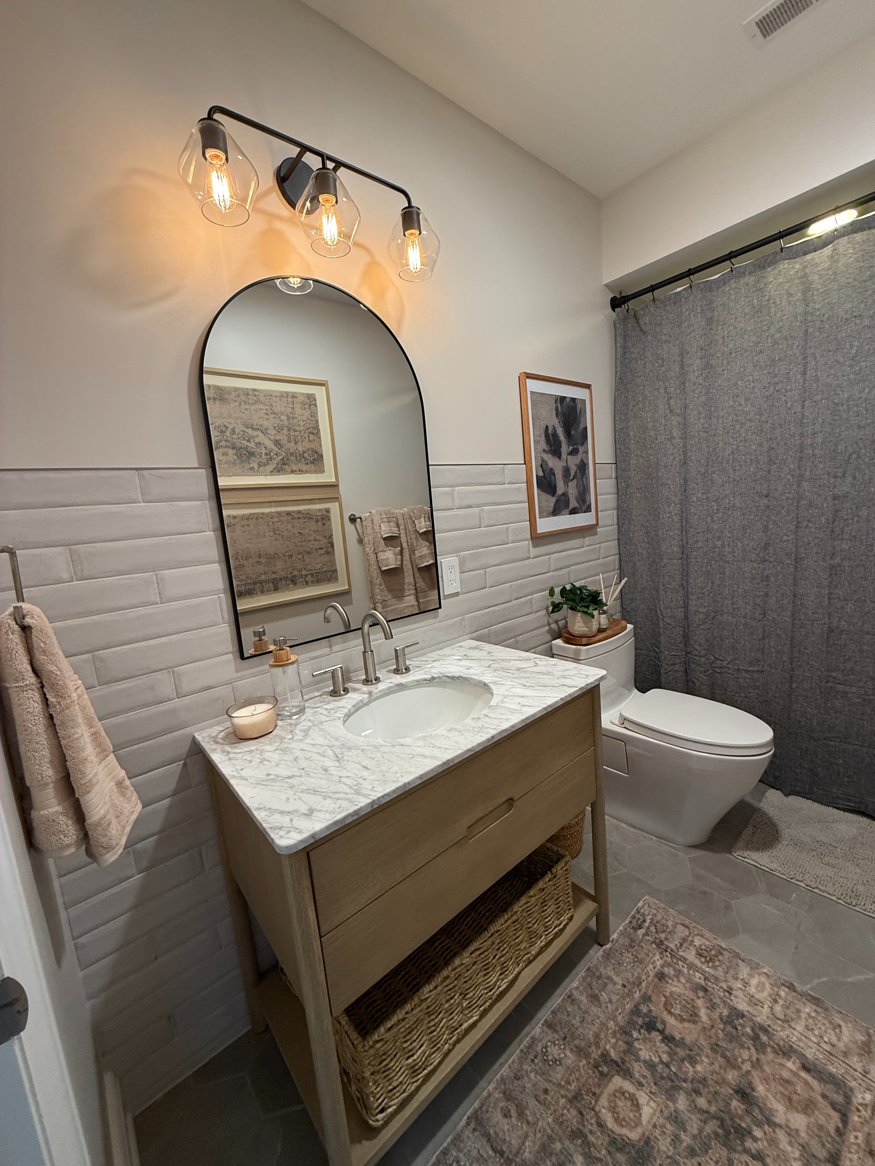 Small bathrooms can still portray big style!  In this space we used tile, pattern and texture to take this space from boring to beautiful.  Linking some of the exact fixtures for your next bathroom revamp.  

 #LTKHome #LTKStyleTip
