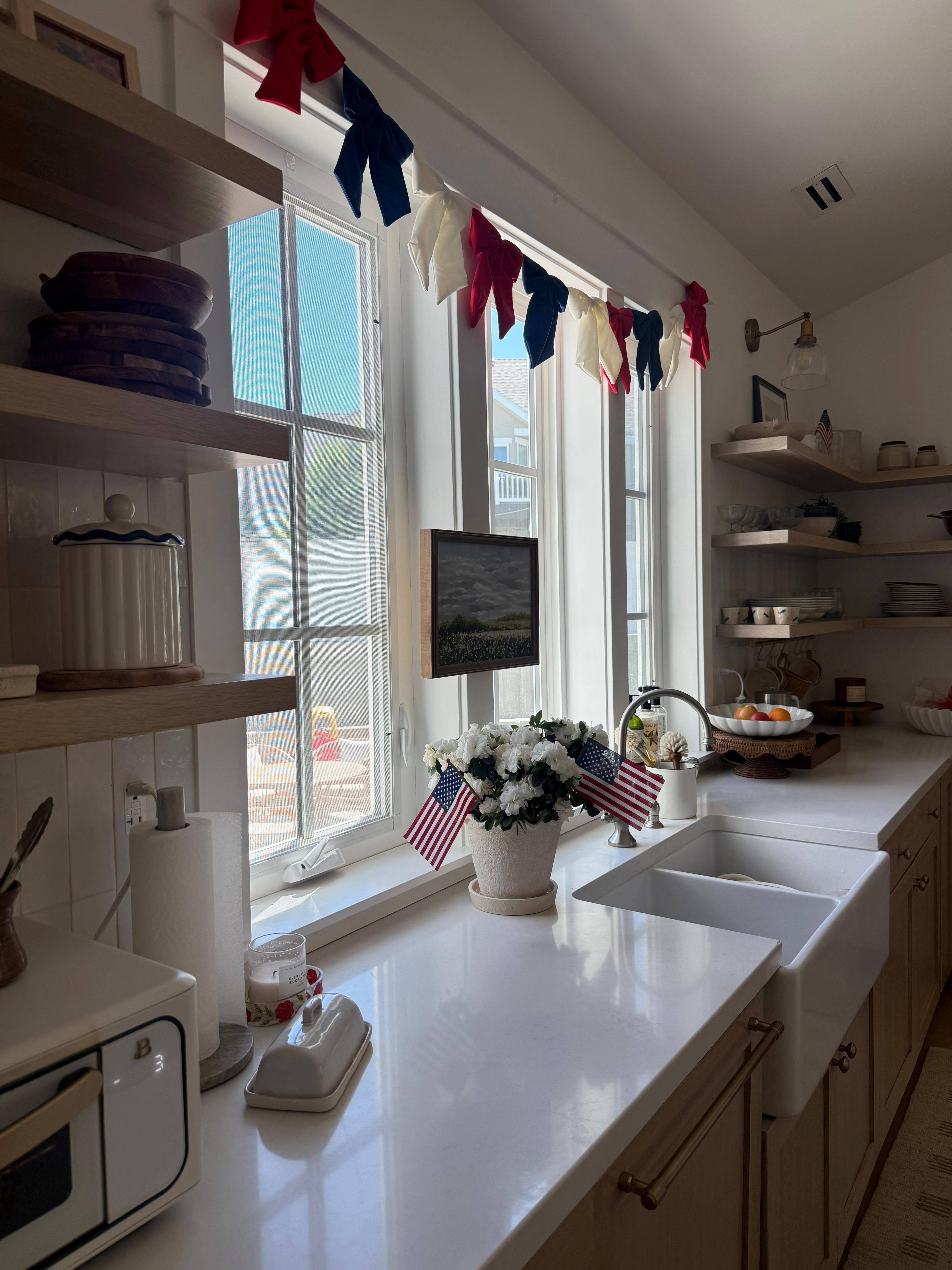 I don't usually decorate for holidays but this bow garland stopped me in my tracks. And when I saw that it was under $20? It had to come home with me. Added some mini flags to my planter and my kitchen is ready for Memorial Day!  

 #LTKSeasonal #LTKHome