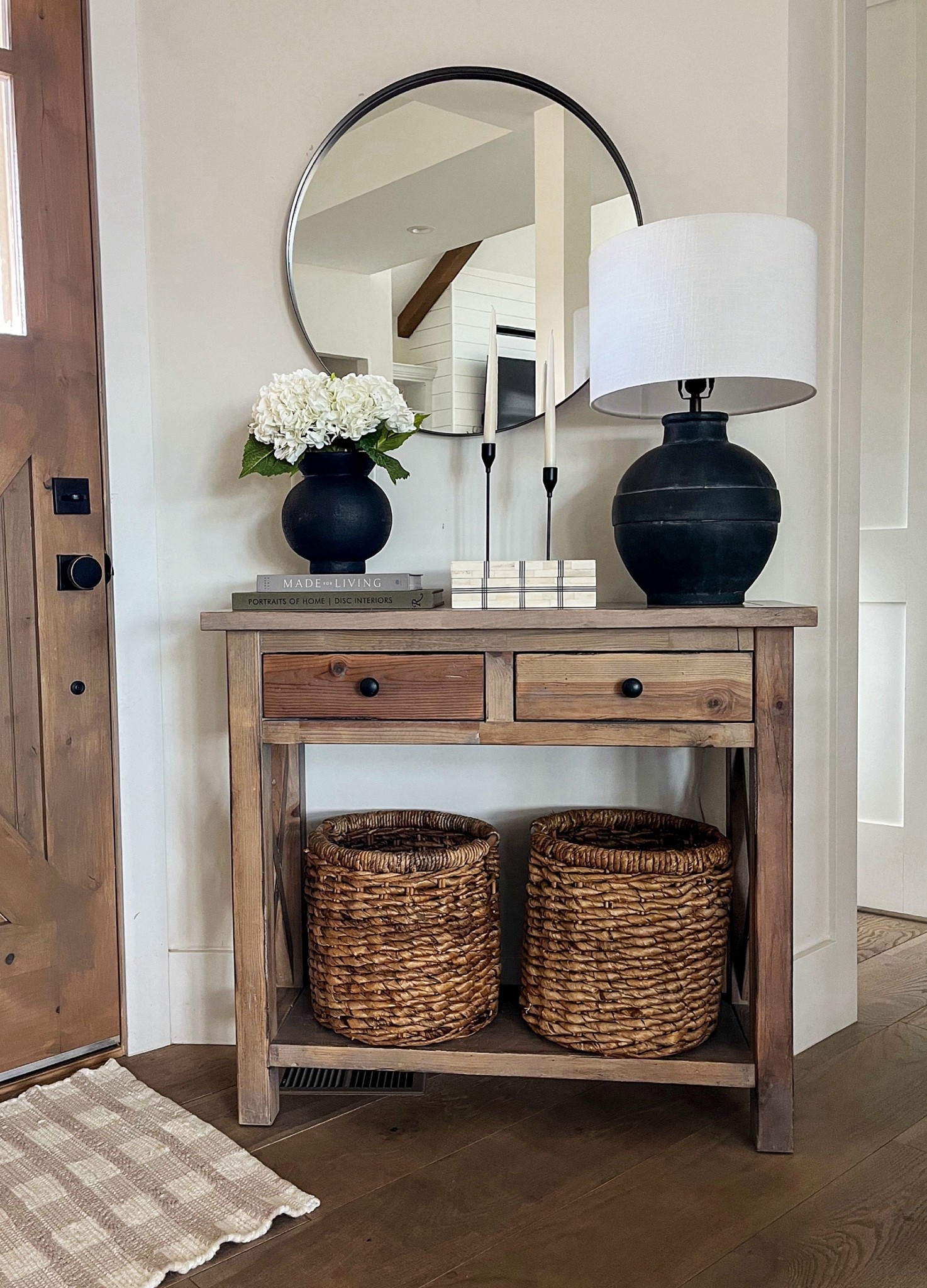 
A simple entryway can still make a statement. This warm, organic modern console setup layers natural wood, black accents, and soft textures for a welcoming first impression. I love using baskets below for hidden storage while keeping the styling clean and elevated on top.
Tap to shop the console table, mirror, lamp, baskets, decor, and entryway essentials to recreate this look.

#LTKHome #LTKEntryway #LTKFinds #EntrywayDecor #OrganicModernHome #NeutralHomeDecor #ConsoleTableStyling #DesignerDetails #LTKShelfie #ShopMyHome