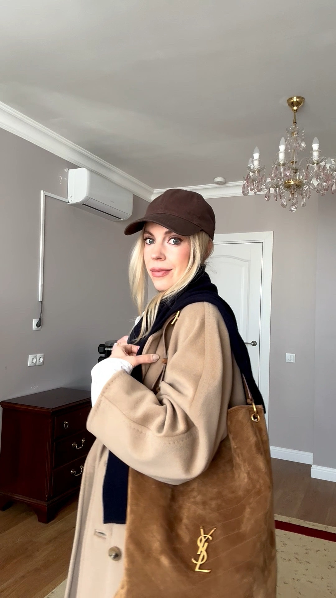 Chic travel outfit, airport style, camel coat, @Zara chocolate brown baseball cap, CBK style, @Zara loafers, @Shopbop cigarette jeans 

#LTKTravel #LTKOver40 #LTKootd