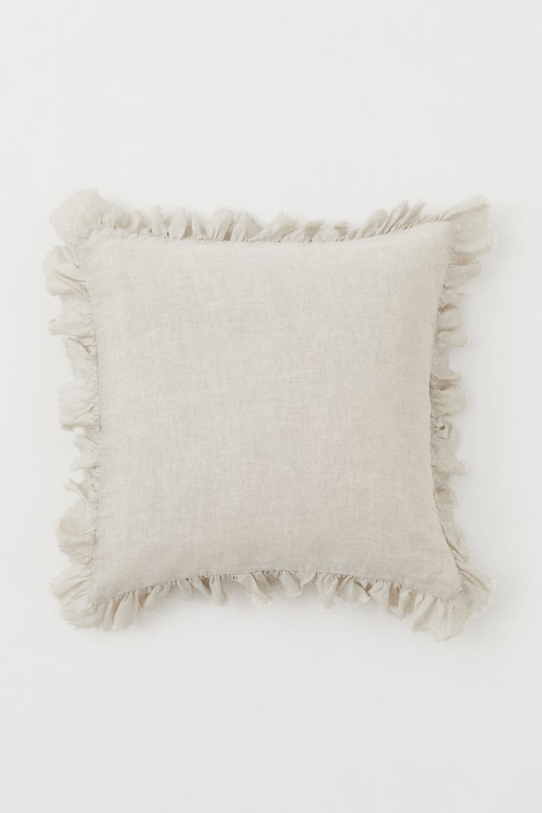 Cushion cover in linen with ruffled, raw-edge trim. Concealed zipper at back. | H&M (US + CA)