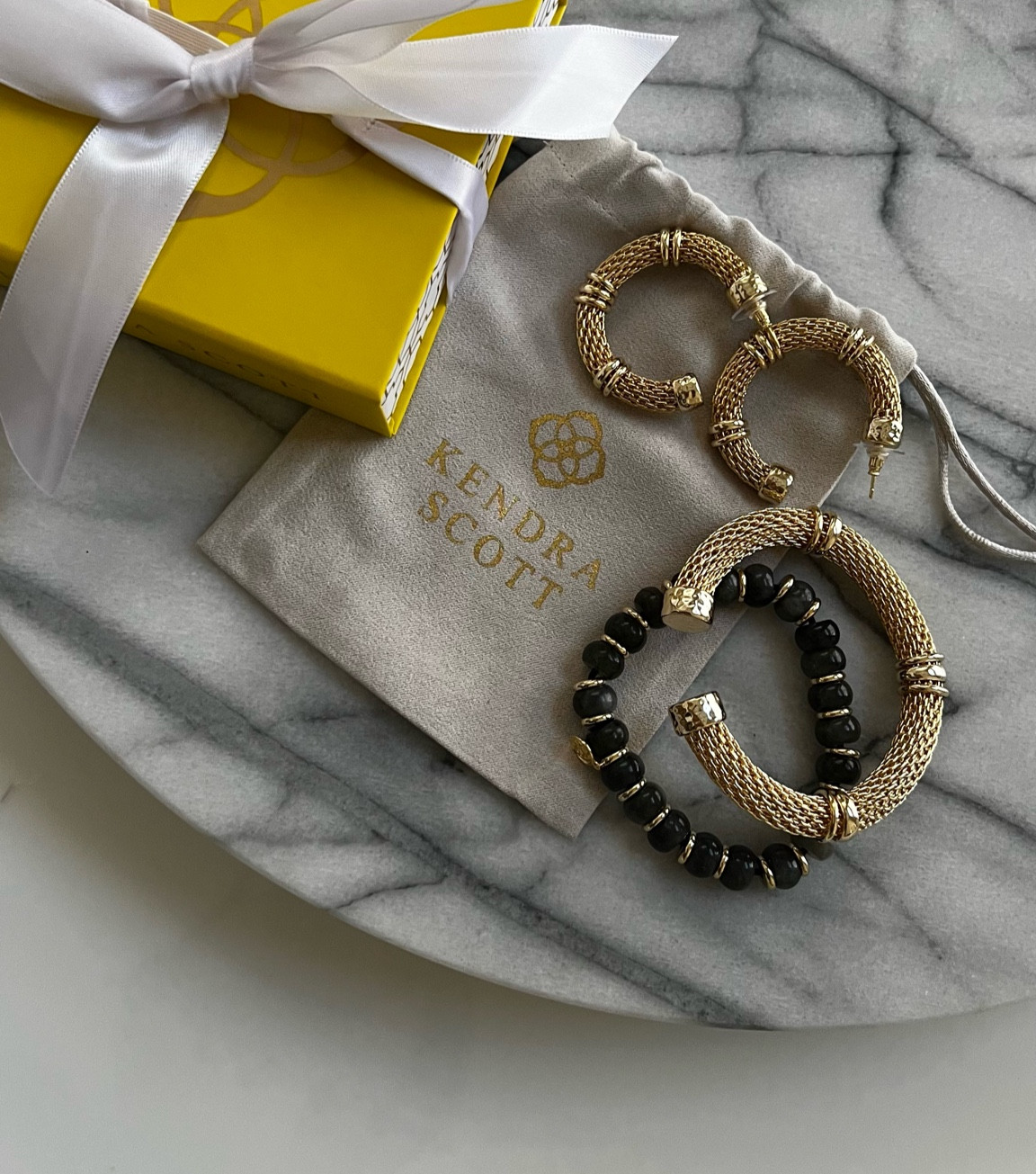 New from Kendra Scott - chunky gold hoops, chunky gold bangle, stretchy beaded bracelet // gold jewelry, statement jewelry, meir, ameirylife 

#LTKU #LTKSeasonal #LTKunder100