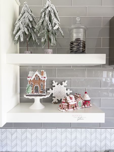 Gingerbread house and Christmas train at Modern Farmhouse Glam

Christmas home decor at Modern Farmhouse Glam, Pine Garland, Holiday decorations, Candy Canes, Winter wreath, stems, flocked Christmas tree, ornaments, holiday gift, Christmas tree trimmings, peppermint ornaments. Snowflake ornaments. Red and white Christmas tree. 

#LTKhome #LTKHoliday #LTKHolidaySale