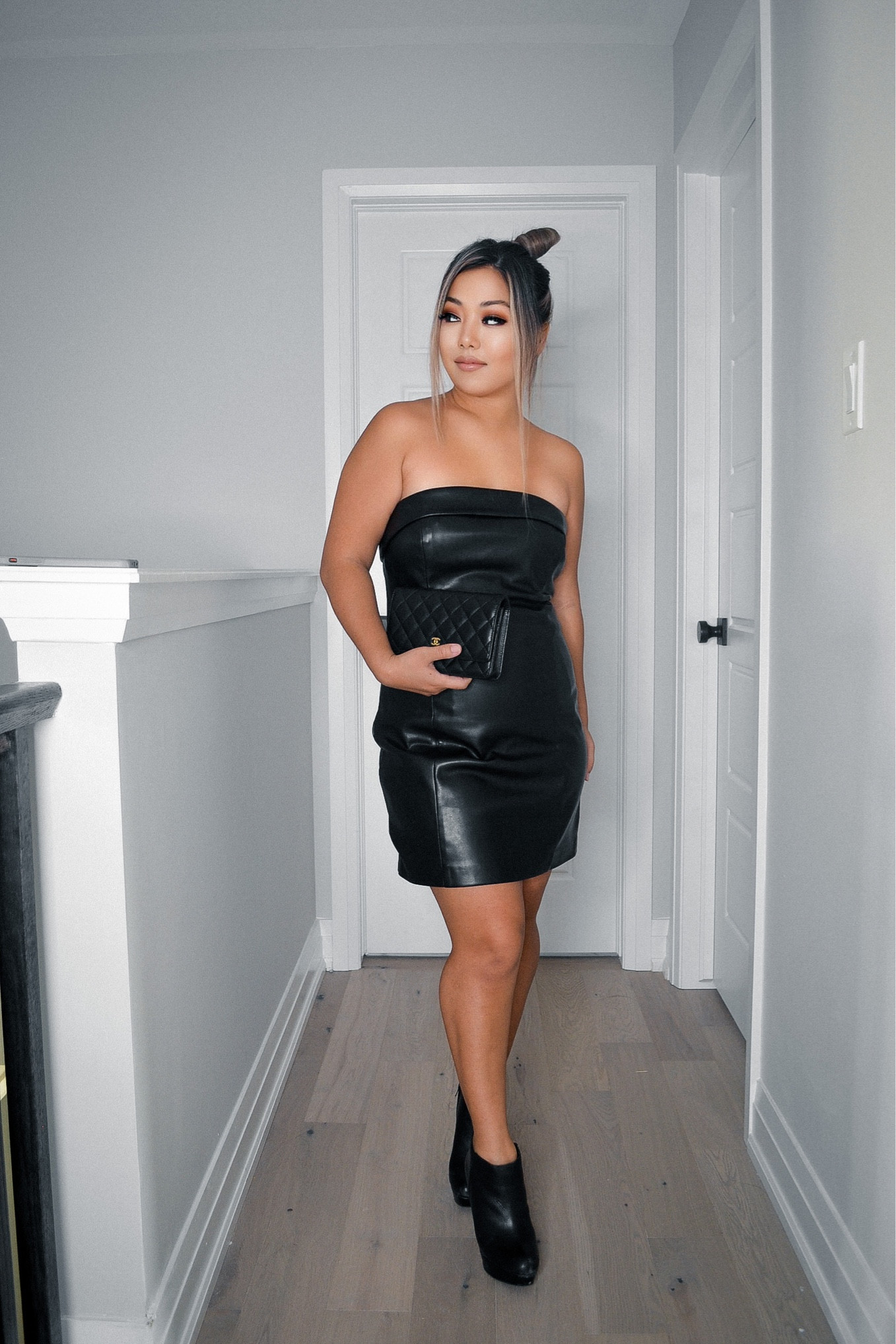 • Jet Black Michelle Mini Faux Leather Strapless Dress 
• Black High Heels
• Chanel Mini