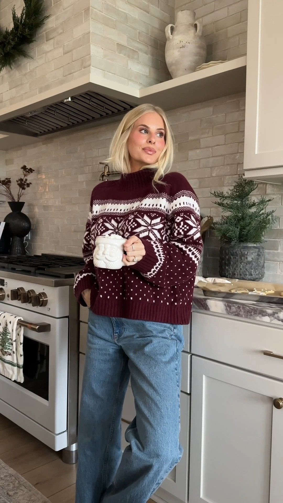 Wearing a large in sweater (for a more oversized fit), 27 long in jeans (medium with raw hem). Linking similar mugs, trees and utensil crock! #kathleenpost

Cozy home vibes, cookie baking day, home decor, winter sweater, winter outfit, mountain chic
