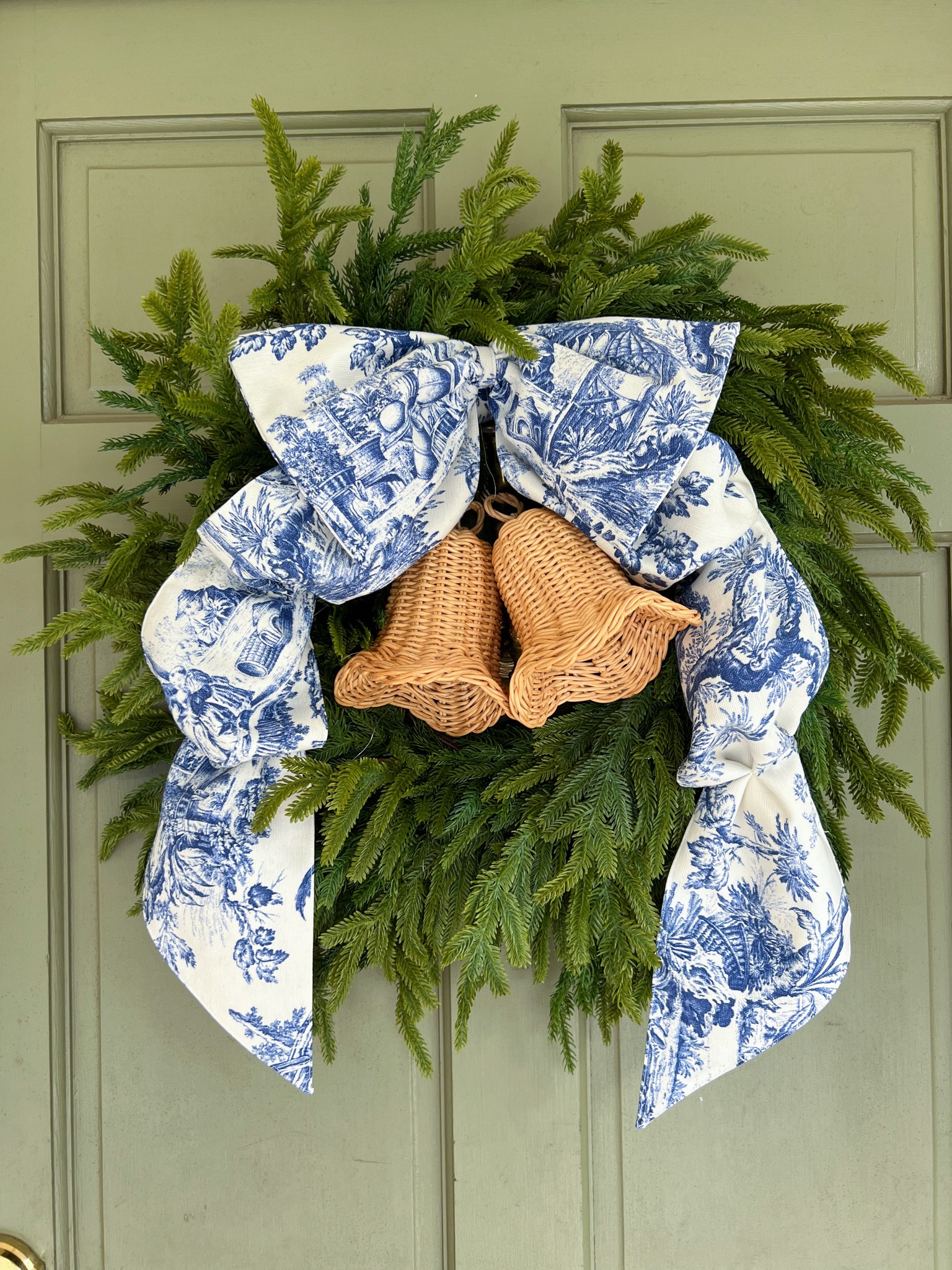 3-ingredient wreath 🎄
This is THE cutest wreath, most GORGEOUS blue toile bow of the highest quality, and more ADORABLE rattan bells! The combination is 🤌🏼 *chef’s kiss* 

Coastal grandmillennial Christmas holiday decor decorations Norfolk pine wreath front porch 

#LTKFindsUnder50 #LTKHome #LTKHoliday