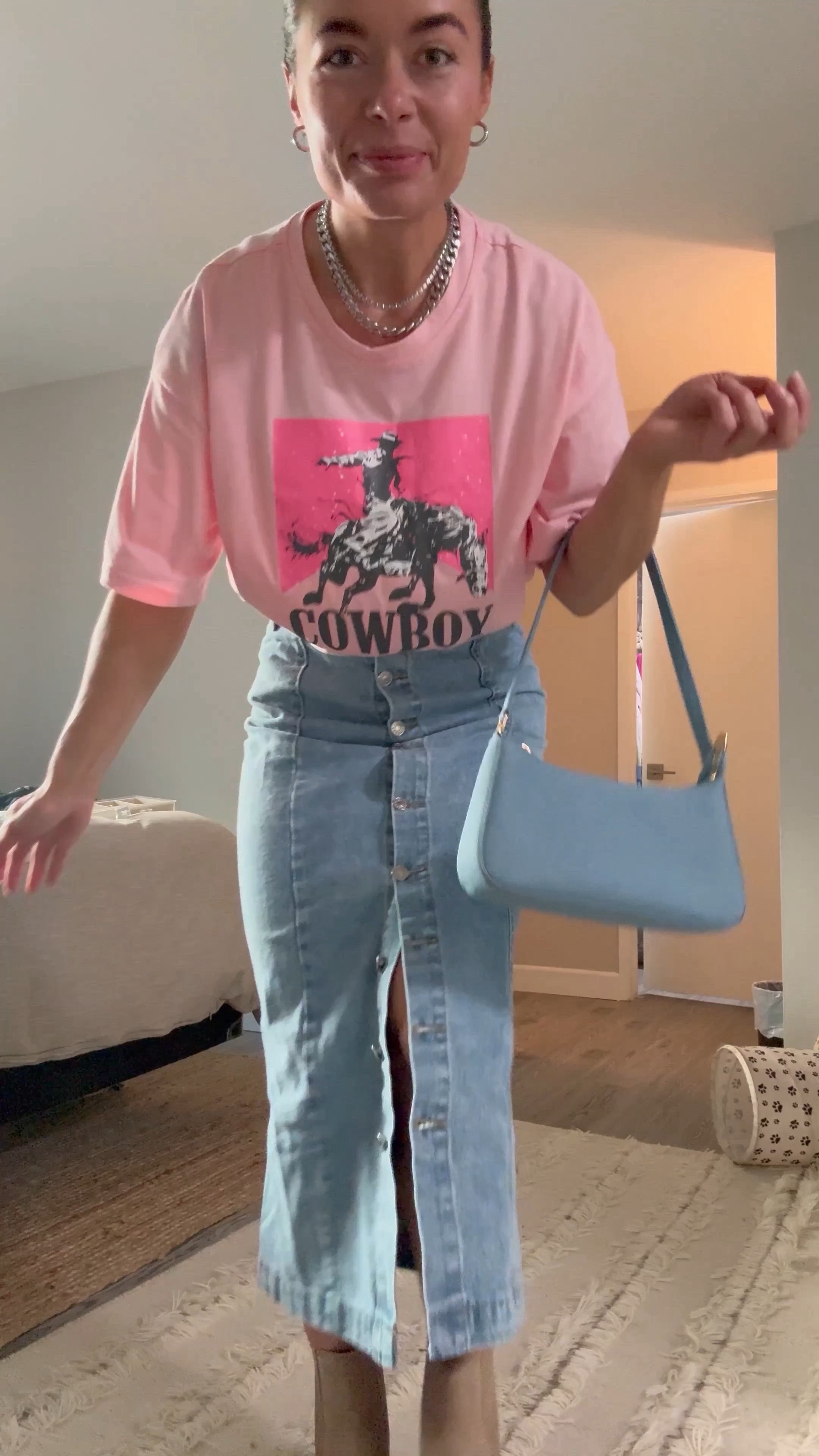 Another coastal cowgirl look just in time for Stage Coach 💕. A western graphic tee paired with a button front longline denim skirt, square toe Dolce Vita booties and silver jewelry accents??? Umm yes please! 

Oversized Cowboy Graphic Tee size Large, skirt is a size Small, booties are a 7.5 (true to size, but I went up half a size to wear insoles). 

#LTKstyletip #LTKSeasonal #LTKfindsunder50