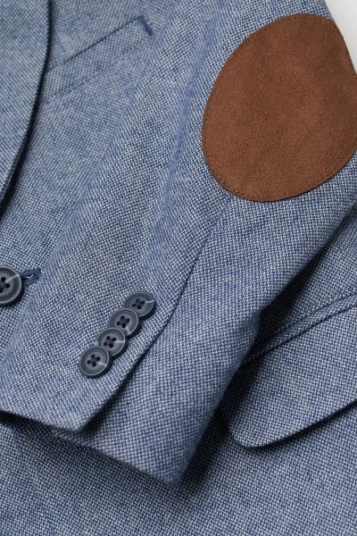 Two-button blazer in cotton twill. Notched lapels, chest pocket, and mock front pockets with flap... | H&M (US + CA)