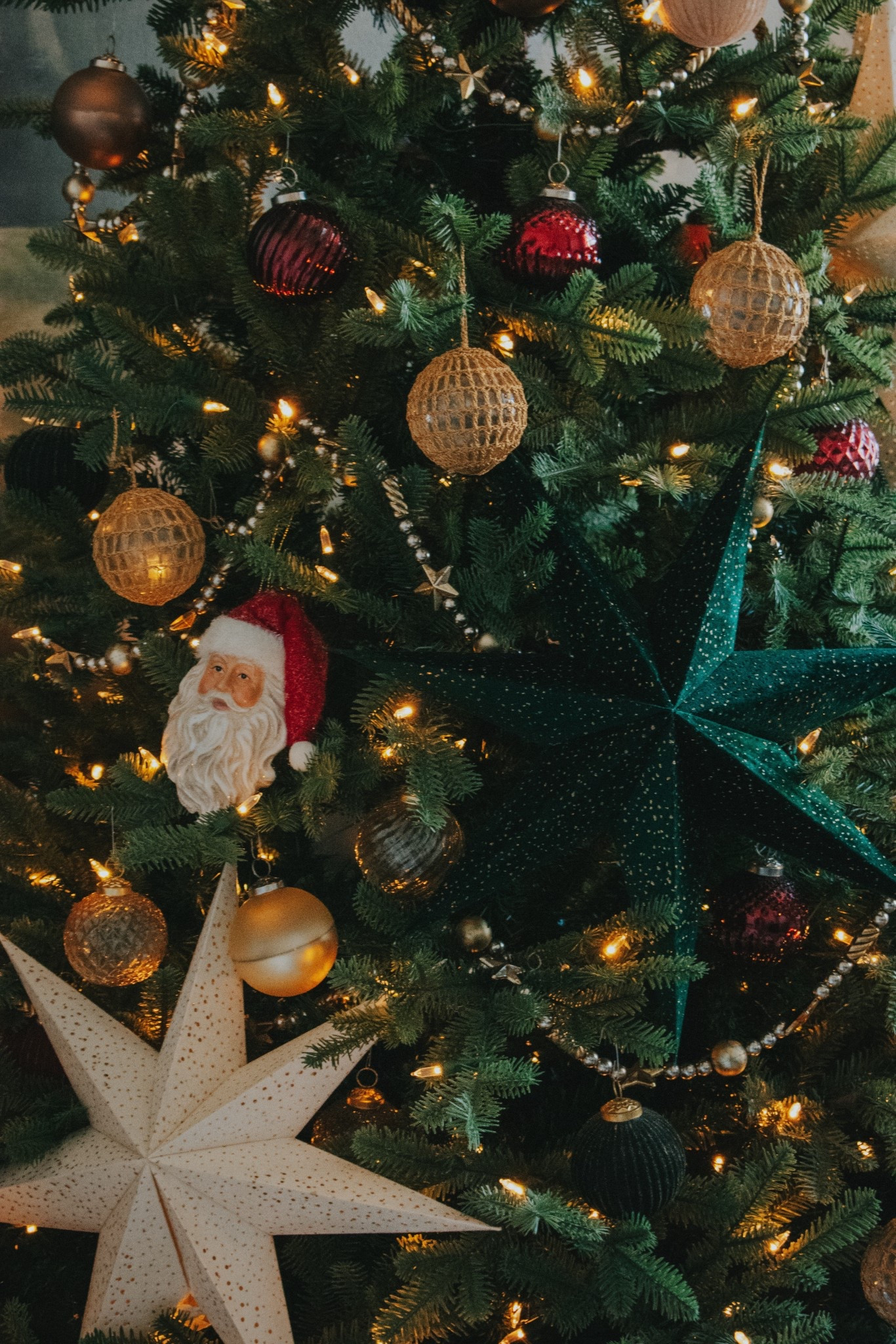 Green, red, gold classic Christmas with deep tones, paper stars, and Santa ornaments (from hobby lobby)

#LTKSeasonal #LTKHome #LTKHoliday