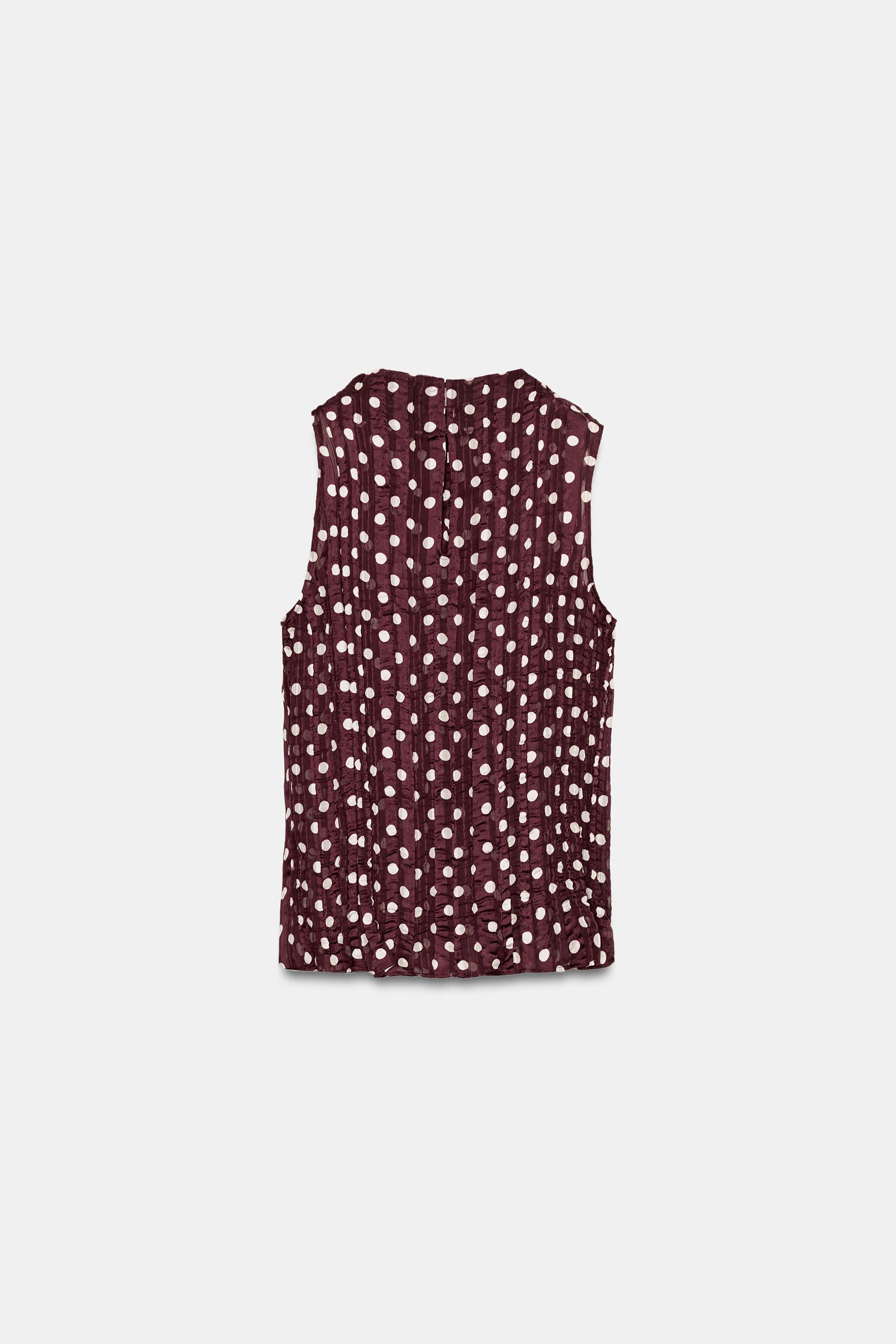Round neck sleeveless blouse with shoulder pleats. Wrinkle-effect printed fabric. Back closure wi... | Zara US