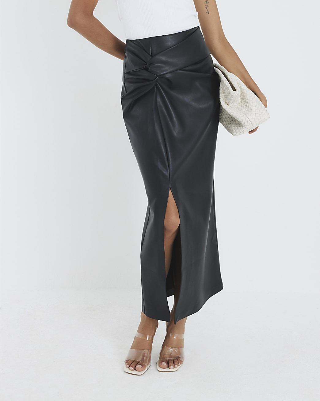 Black Twist Side Faux Leather Midi Skirt | River Island UK & IE