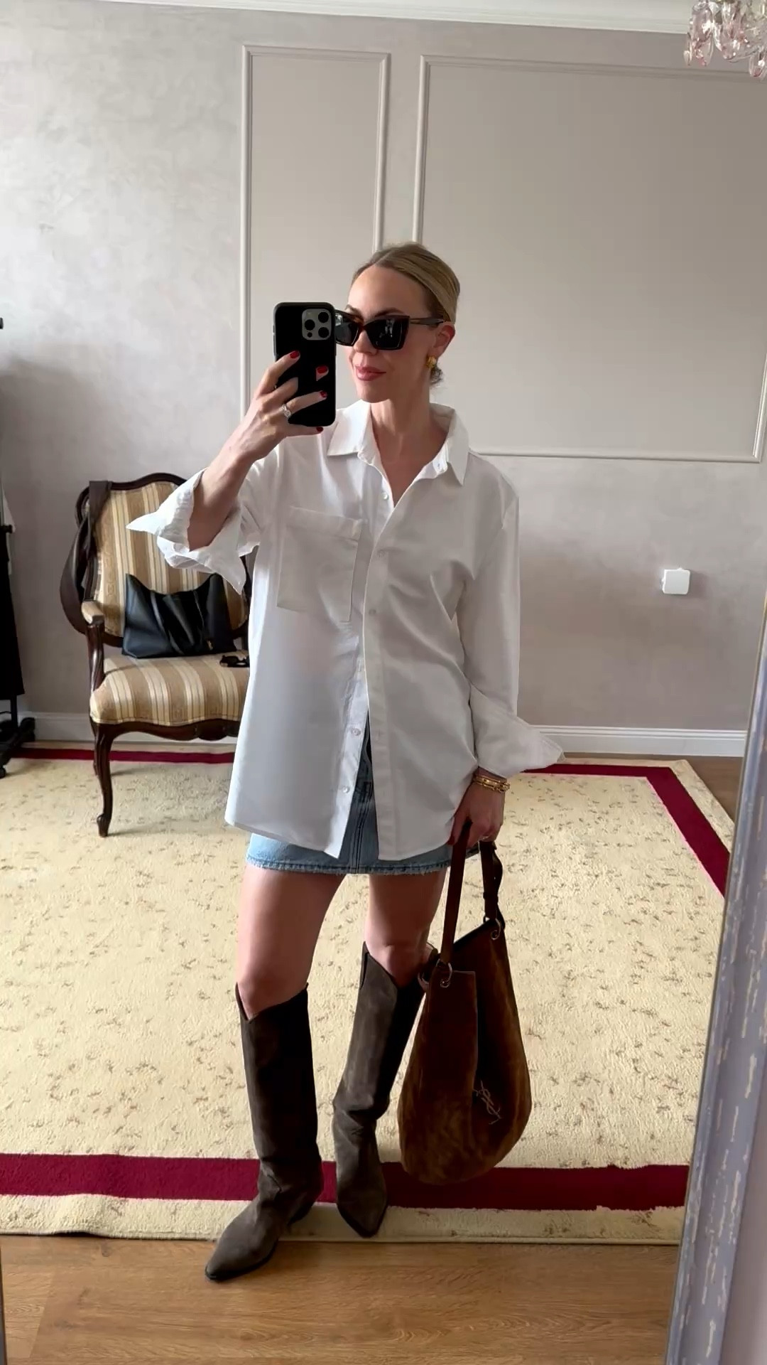 @Levi's denim skirt on major sale 

Spring outfit, oversized white button down shirt with denim mini skirt, western boots, suede YSL tote bag, spring trends 

#LTKSaleAlert #LTKOver40 #LTKSeasonal