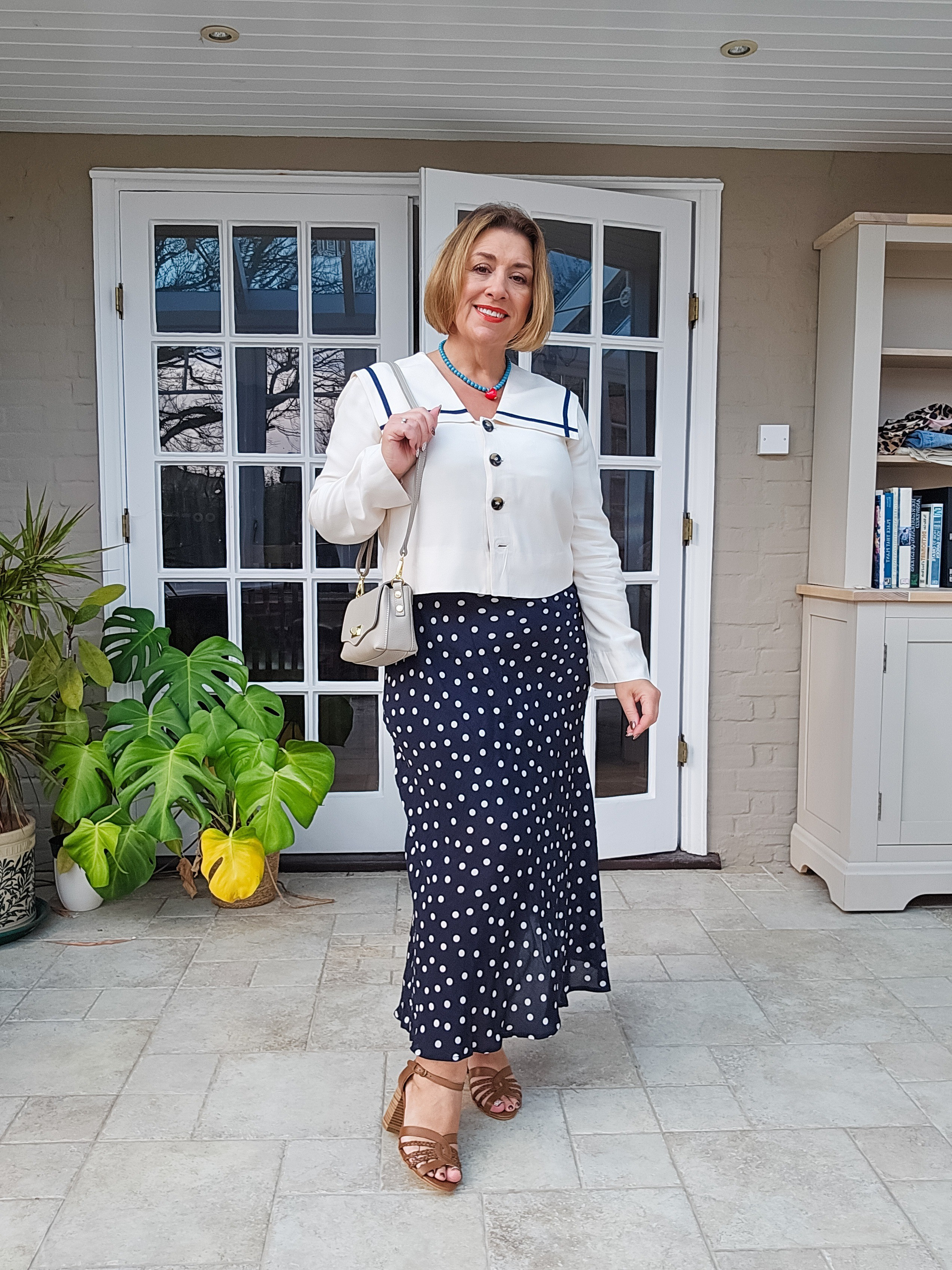 Spring outfit. Ideal for Mother's Day, Easter, a Spring wedding etc.Beautiful polka dot dress with a fully lined sailor collar top. Tan heeled sandals.Lipstick is MAC TNTeaser

#LTKspring #LTKover50style #LTKmidsize