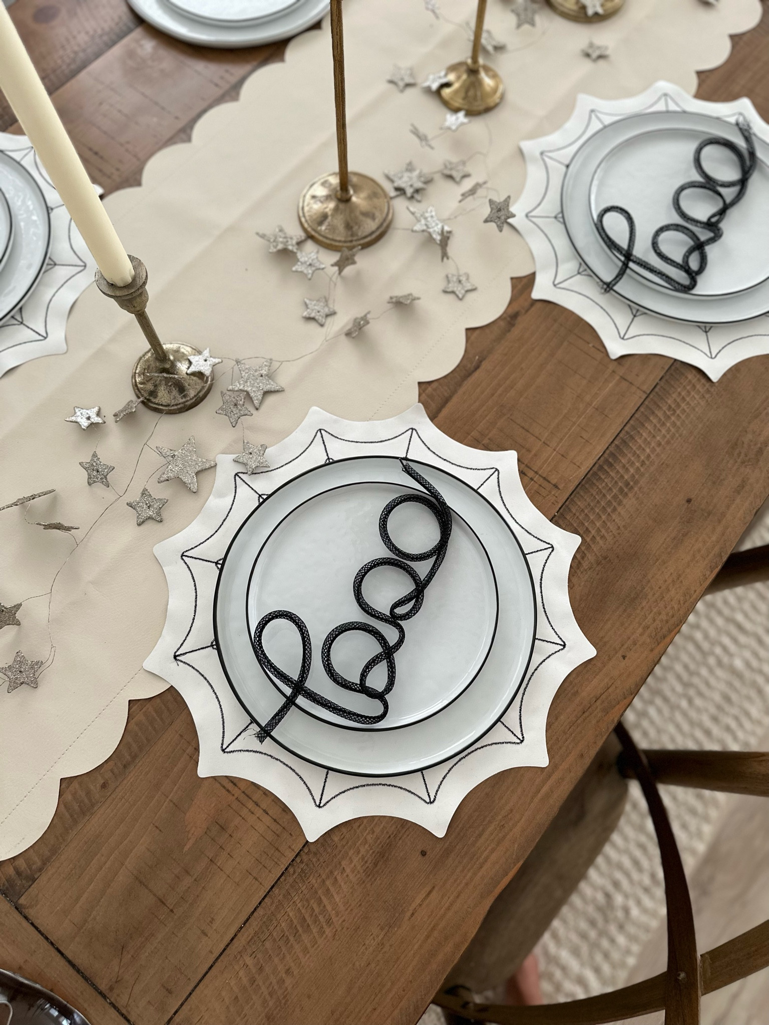 Black and white plates, table runner, candle sticks, garland, stars dinning room #fallsdecor #dinningroom 

#LTKhome #LTKstyletip #LTKSeasonal