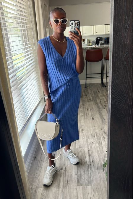Cozy travel outfit! Blue ribbed V-neck sleeveless skirt set. I’m wear a small and it’s perfectly comfy with room. Worn with white new balance sneakers, white Ganni purse, pearl embellished cat eye sunglasses, gold rope necklace and gold drop earrings. 

#LTKshoecrush #LTKunder100 #LTKtravel