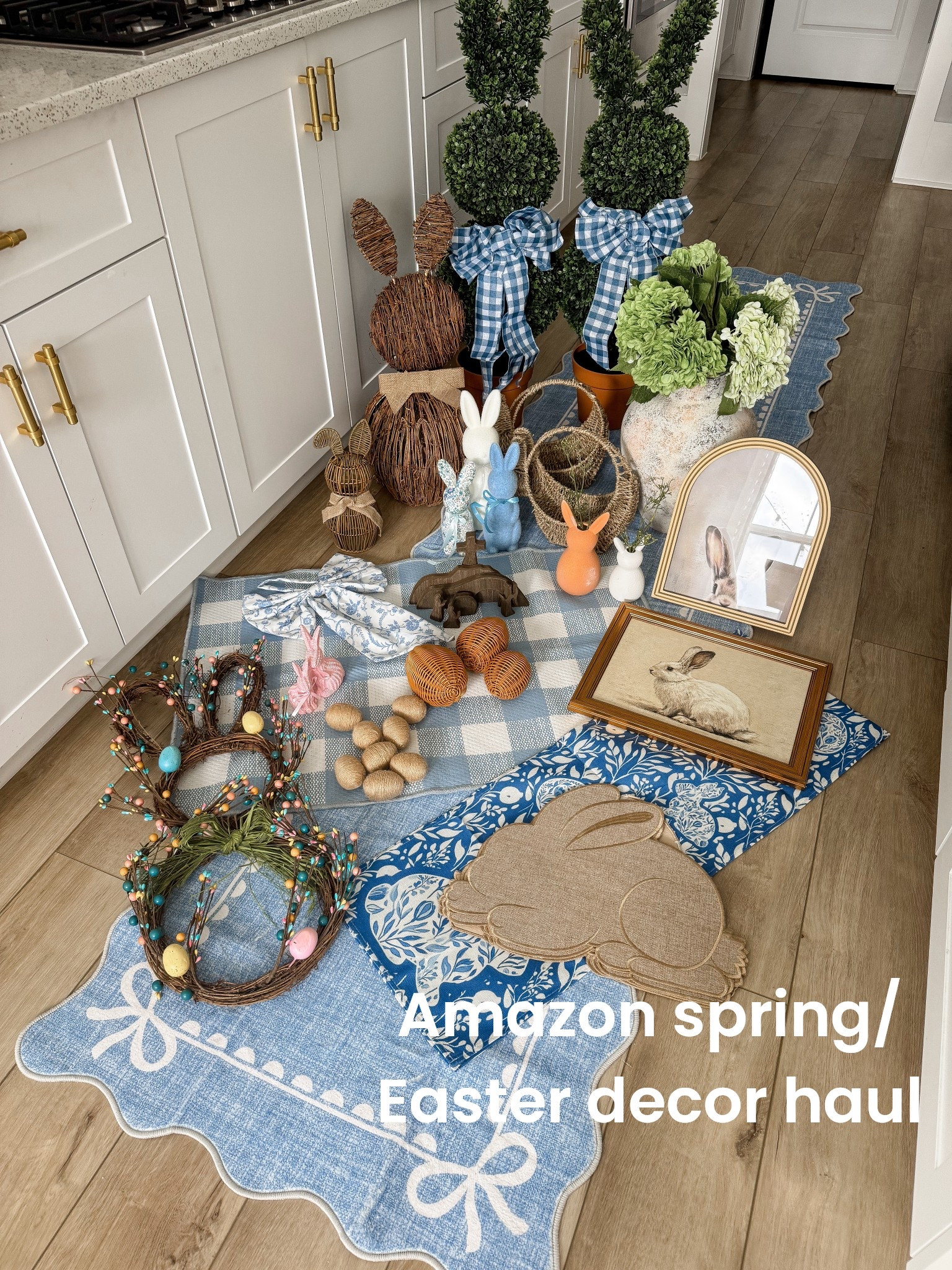 Spring and Easter decorating has officially begun and this entire haul is from Amazon 🌸🐰 I am SO excited about these finds because they look like high-end boutique or Pottery Barn style pieces, but they’re all super affordable!

From the blue scalloped bow rug and layered spring runners, to the oversized wicker bunny, gingham bow topiaries, and the sweetest bunny wreath with pastel eggs… every piece adds that soft, classic spring charm. I also grabbed the cutest bunny figurines, framed rabbit art, jute carrots, woven baskets, and the most beautiful textured vase with faux hydrangeas 🌿

I love mixing natural textures (wicker, jute, wood) with soft blues and gingham for that timeless Easter look. Everything is perfect for entryway styling, kitchen decor, or creating a cozy spring corner in your home.

If you’re starting your spring refresh or planning your Easter decor, these Amazon finds are SO good and easy to style together.

#springdecor #easterdecor #amazonhome #amazonfinds #easterhome #springhome #bunnydecor #seasonaldecor #entrywaydecor #kitchendecor #amazonhaul #blueandwhitehome #springrefresh

#LTKHome #LTKSeasonal