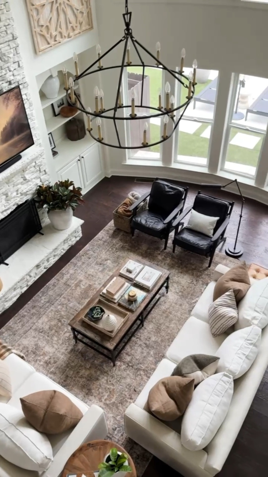 This time of year, I love to have a warm neutral living room, with lots of textures and subtle colors. home decor living room decor brown pillows plaid throw alabaster walls iron chandelier neutral décor

#LTKHome #LTKSeasonal