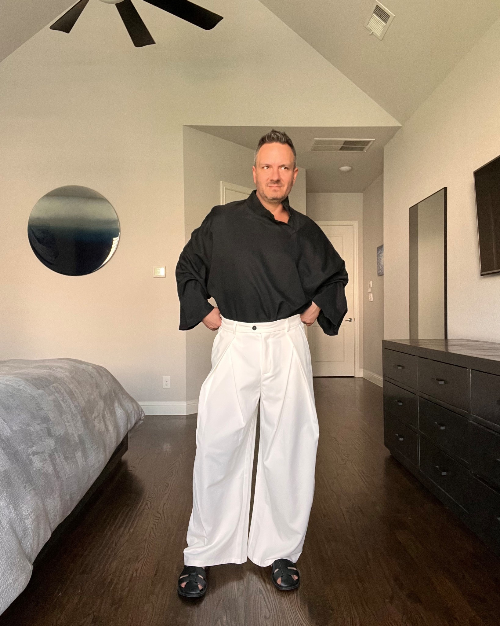 Flowy black top with wide-leg white trousers is a strong contrast look that feels very current. The volume up top and bottom keeps it fashion-forward without losing comfort. Wear this to beach clubs, summer parties, or anywhere warm where you want to stand out quietly.

#summerstylemen #whitetrousers #resortstyle #mensoutfitinspo

#LTKSeasonal #LTKMens #LTKootd