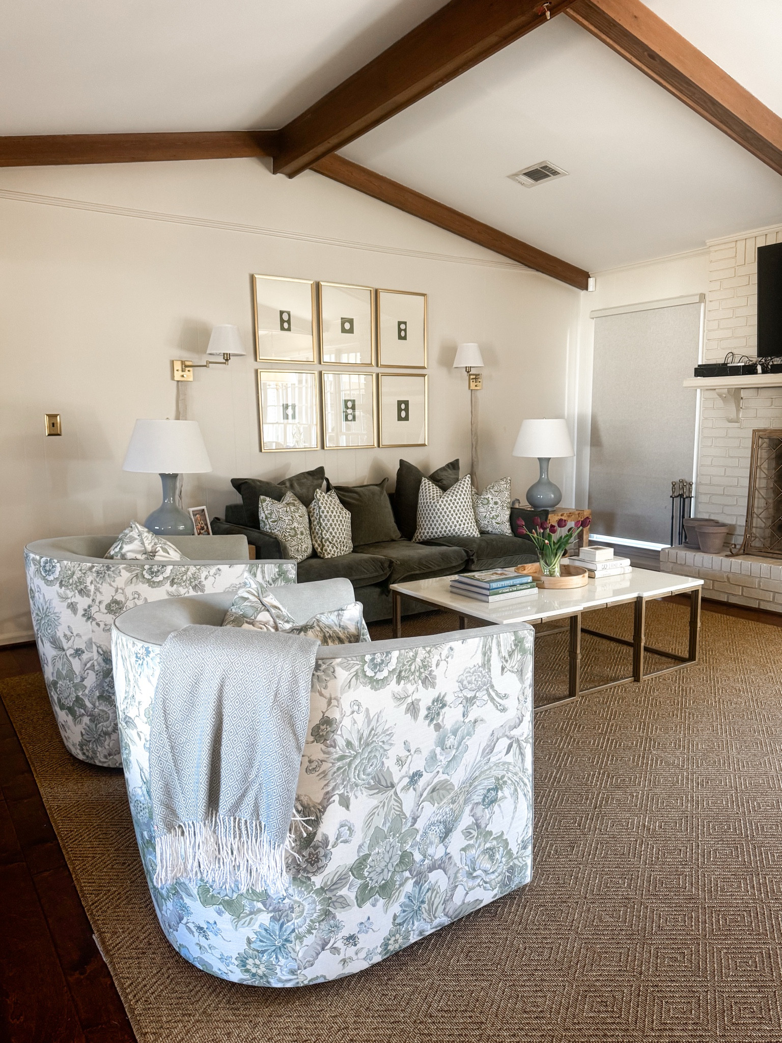 Living room sources. All linked except custom swivel chairs. Amazon frames and Etsy intaglios. Loveeee these Amazon block print throw pillows!! The sofa is also Amazon. Wouldn’t recommend for your main sofa but for conversation area, sure. You can feel the springs… linking similar sofa in green velvet fabric. Linked all my fave green and blue coffee table books 😻 Thanks for shopping with me! #southerndecor #grandmillenial 

#LTKHome #LTKFindsUnder50 #LTKStyleTip