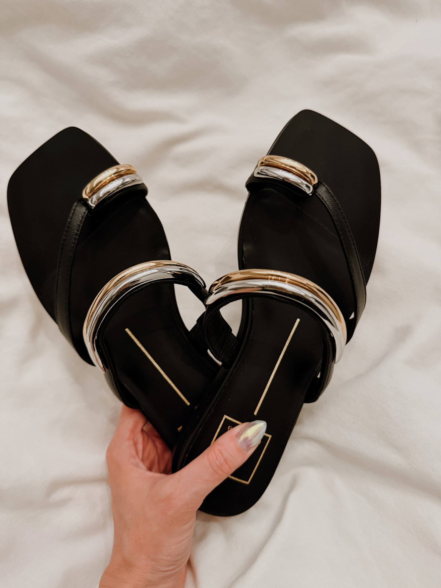 Found the perfect "cool girl" sandal for the season. 🖤 The dual-tone hardware gives such a modern, sculptural vibe. These are definitely going to be my most-reached-for pair this summer. 

#LTKshoecrush #summerstyle #mixedmetals #sandals #minimalistfashion #streetstyle

#LTKPetite #LTKootd #LTKSeasonal