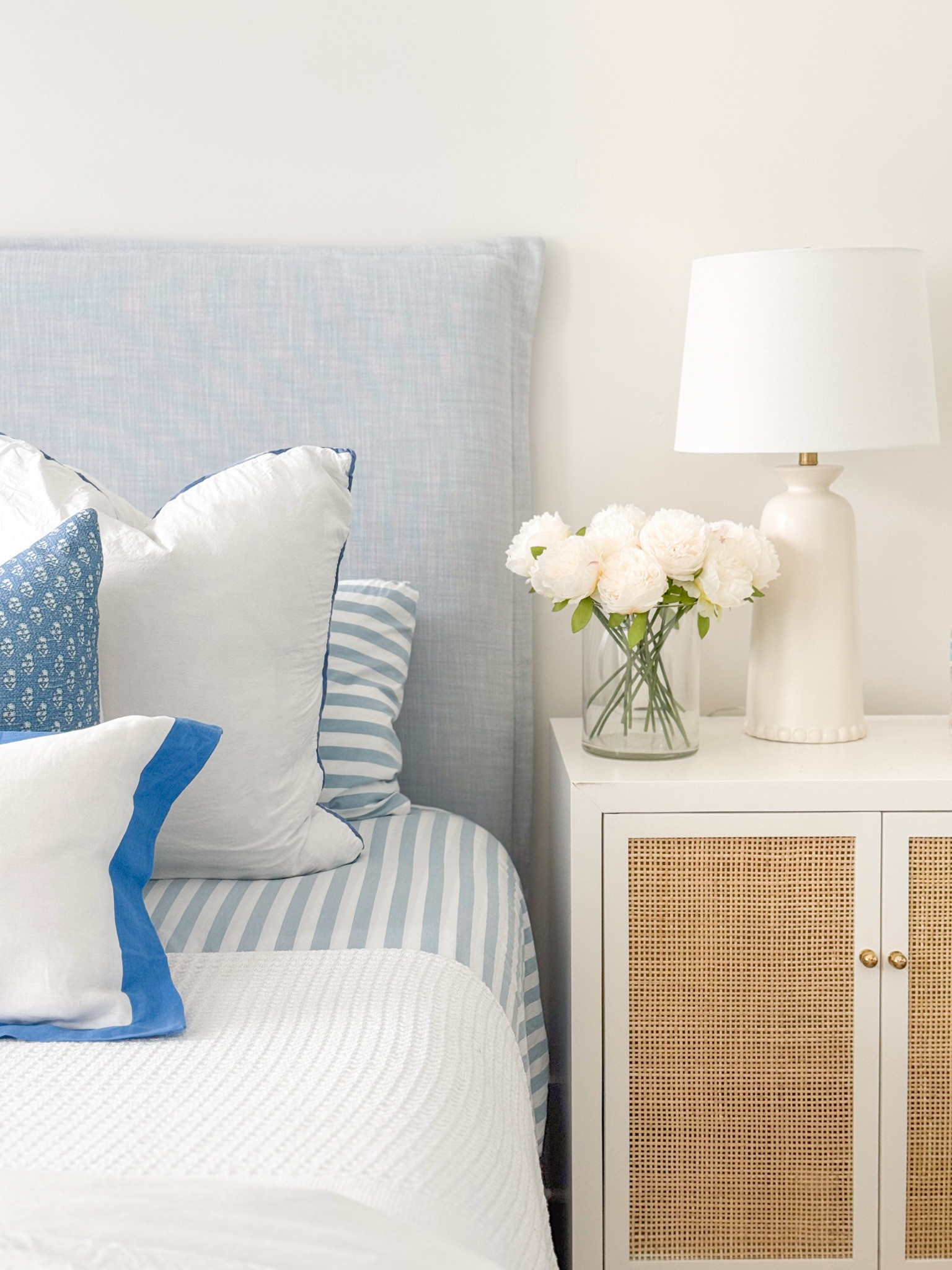 I finally pulled off our Christmas bedding today and gave our bedroom an unplanned but fresh look with blue and white striped sheets, white duvet cover, block print throw pillows and waffle knit blanket on our light blue linen bed. I also added my favorite faux peonies (mine are White not Pure White) on our cane nightstands! Also linking a look for less for our bed  and nightstands - both of which we also own! #ltkhome #ltkseasonal #ltkhome #ltksalealert #ltkfindsunder50 #ltkfindsunder100 #ltkstyletip 


#LTKHome #LTKSaleAlert #LTKSeasonal