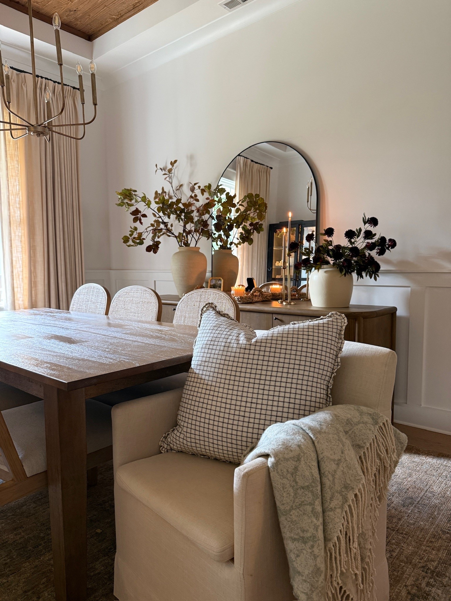 Cozy autumn styling in our neutral dining room 🤍 I love the seasonal fall stems, throw blanket and pillow, and cozy fall decor in this space.

#LTKHome #LTKSeasonal