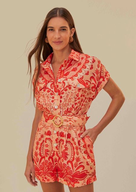 Farm Rio
Red Jaipur Romper

Embrace the vibrant essence of summer with the Red Jaipur Romper from FARM Rio. This eye-catching piece is adorned with an intricate, folk-inspired pattern in a radiant red and soft peach palette, creating a captivating visual symphony. The relaxed collar lends a touch of sophistication, while the cinched waist—accented by a charming bamboo belt buckle—flatters the silhouette. Effortlessly transitioning from day to night, this romper is an ode to playful elegance and spirited adventures.

#LTKParties #LTKStyleTip