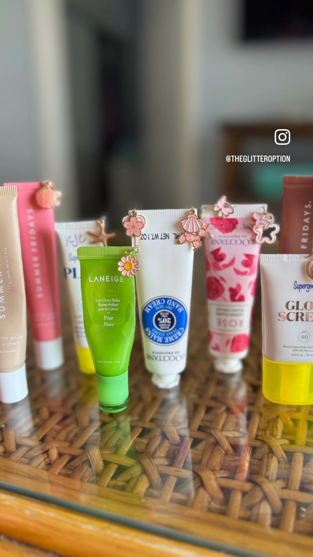 the cutest beach side craft 🐚 we can always use a few minutes break from the sun when we are at the beach. 
I brought a packet of cute charms, then we gathered our lipglosses that have a crimp on the end, used a pushpin to poke a hole, pushed a ring through and hung a cute charm 😎

#beachcraft #vacationcraft #sunbreak #craft #danglycharms

#LTKTravel #LTKSeasonal #LTKStyleTip