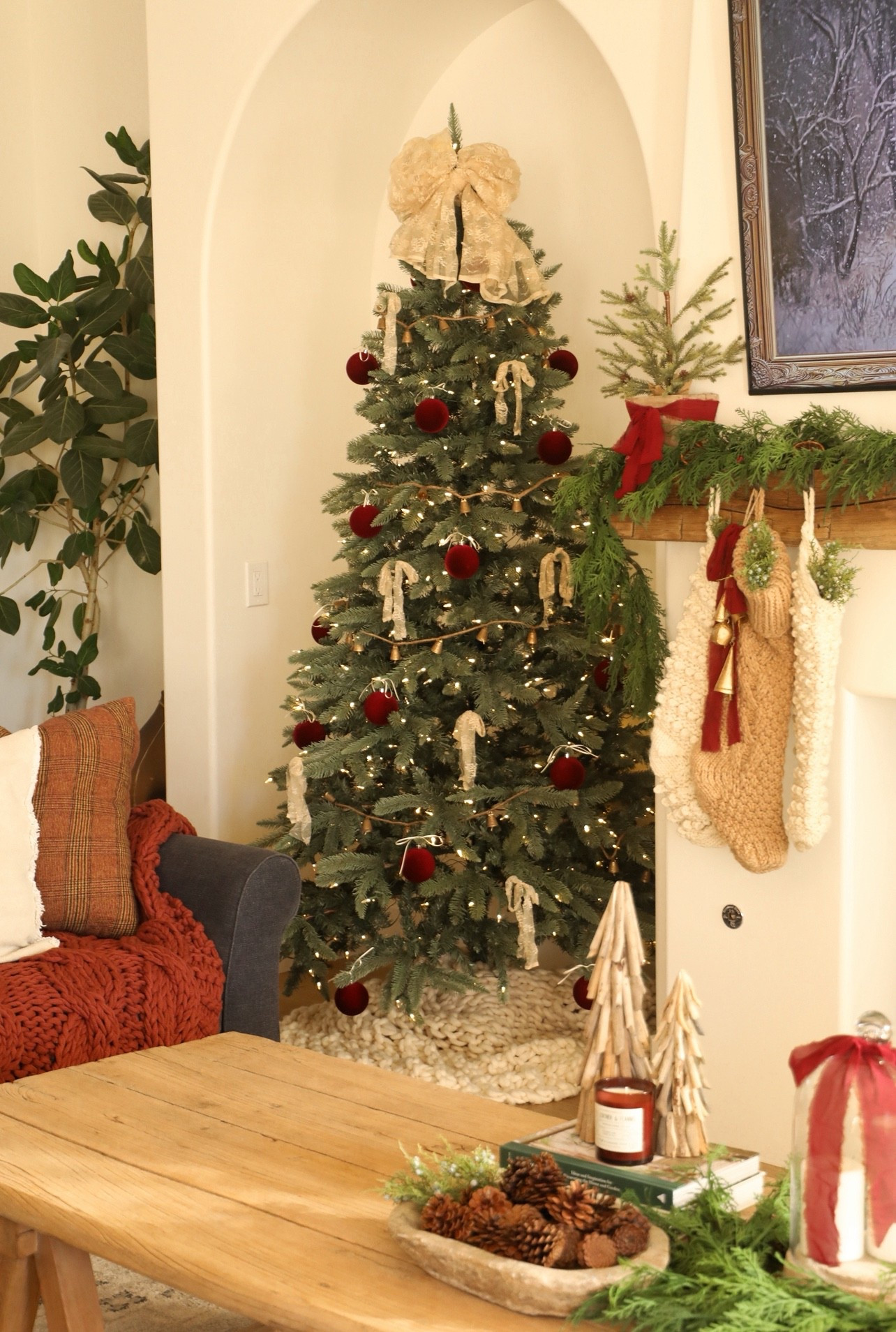 Simple Christmas tree decor. I just used some velvet burgundy ornaments, gold bell garland, and strips of lace fabric for the bows. Also, I bought this tree 4 years ago but they updated the tree to include a twinkle feature ❤️🎄 #ltkhome #christmasdecor #holidaydecor #christmastree #livingroom 

#LTKHoliday #LTKHome #LTKSeasonal