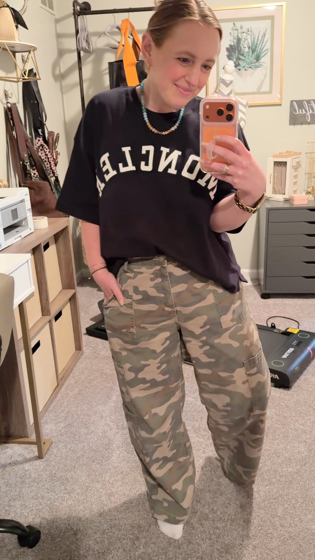 This top is one of my favorite finds from the outlet mall we visited in Florida!  I paired it with my favorite Walmart pants, sneakers (not wearing them here) and my “candy” necklace (as my students call it).

#LTKootd #LTKgrwm #LTKdayinmylife