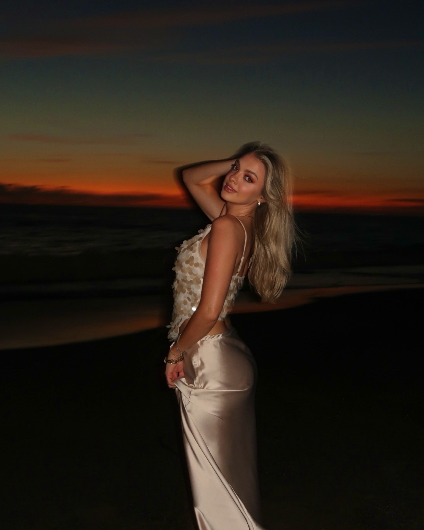 Proof that the best moments happen after the sun goes down 🧡✨🥂🌴🌊🌅  The perfect vacation outfit every girl needs! @modelistemagazine @velasvallarta 
.
.
.
sunset beach dinner, girls trip memories, beach night outfits, satin slip skirt outfit, beach dinner aesthetic, sunset by the ocean, girls night travel, coastal night vibes, vacation glow, romantic beach evenings, seaside dinner style, sneakers with dresses, golden hour beach photos, travel diary moments, soft girl travel aesthetic

#LTKootd #LTKTravel