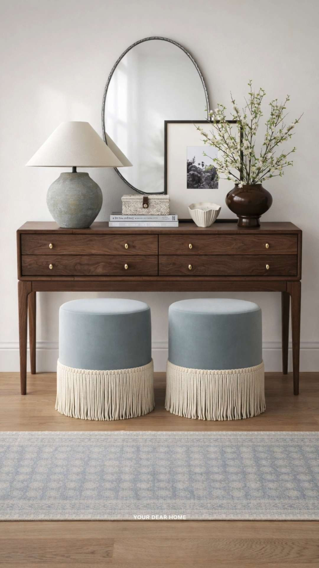 A slightly richer take on a spring entryway. The deeper wood tones paired with soft muted decor and subtle greenery keep it feeling fresh without losing that grounded, classic look. 

 #LTKSeasonal #LTKHome