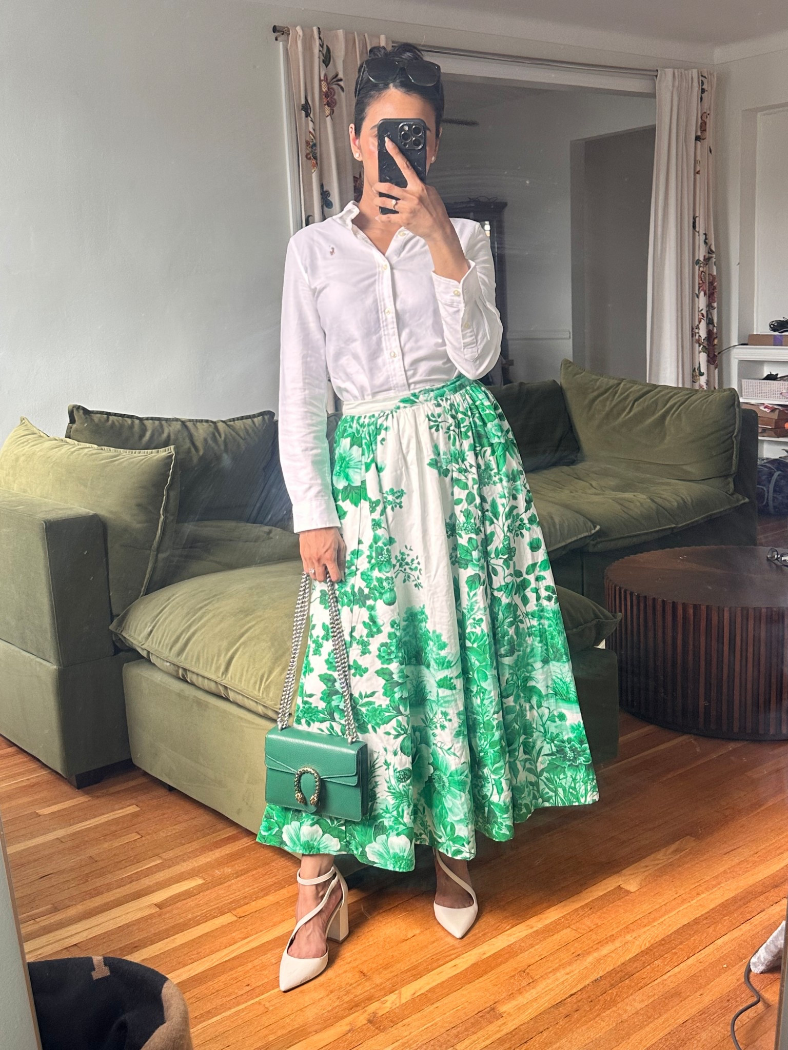 Garden party vibes in full bloom 🌿✨ Styled this crisp white button-down with a floral statement skirt and my go-to block heels for a polished summer look. This green bag is giving just the right pop 🍃 Everything is linked on my LTK 💚

#LTKStyle #LTKSummer #WeekendLook #GardenPartyStyle #ElegantOutfit #ChicAndClassic #OOTD #StyleInspo #WhatIWore #FloralSkirt #PreppyStyle #SummerStyleEdit #GreenIsTheMoment

#LTKStyleTip #LTKSeasonal #LTKTravel
