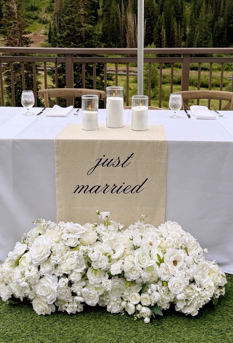 Just married linen sign on minimalist sweetheart table with white florals

#LTKWedding